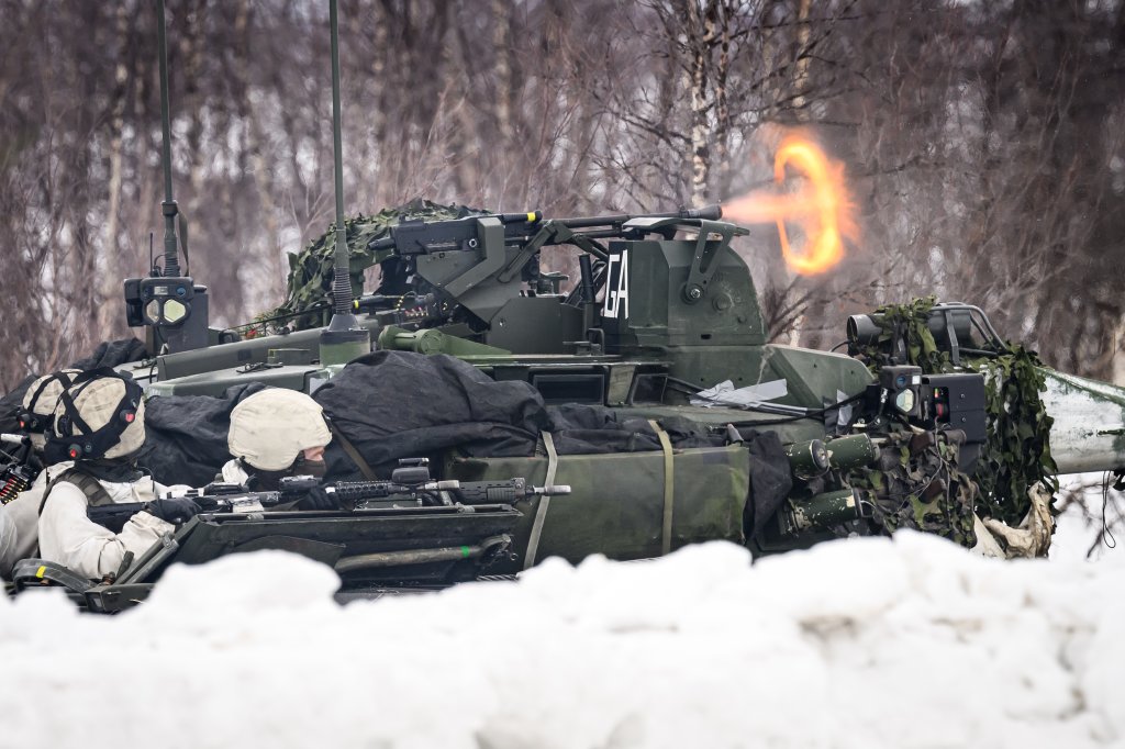 KIVILOMPOLO, FINLAND - MARCH 09: Swedish soldiers take part in an exchange of fire with "enemy troops" using blan rounds during a training exercise, visible to the media, on the Finland/Norway border during the Nordic Response military exercise on March 09, 2024 in Kivilompolo, Finland. The exercise, which primarily takes place across Scandinavia from March 3-14, features 20,000 troops from 13 allied countries. Following the recent NATO expansion, the group now includes Finland and Sweden. (Photo by Leon Neal/Getty Images)