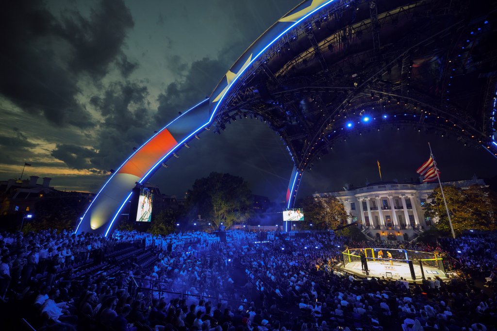 WASHINGTON, DC - JUNE 14: Guests, including members of the U.S. military, attend the Ultimate Fighting Championship (UFC) Freedom 250 mixed martial arts event under the open-air 