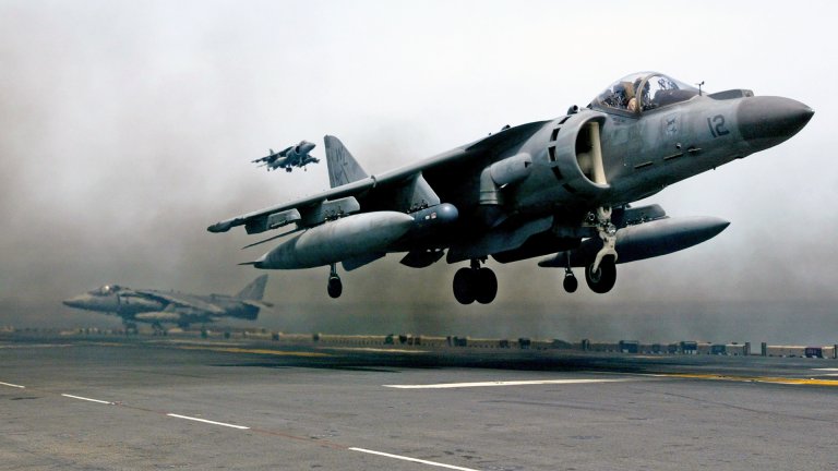 PERSIAN GULF - APRIL 4 : A U.S. Marine Harrier jet lands on the flight deck of the U.S.S. Bon Homme Richard April 4, 2003 in the Persian Gulf. Harrier jets from the Bon Homme Richard continue to carry out bombing missions in support of the U.S.-led in Iraq. (Photo by Justin Sullivan/Getty Images)