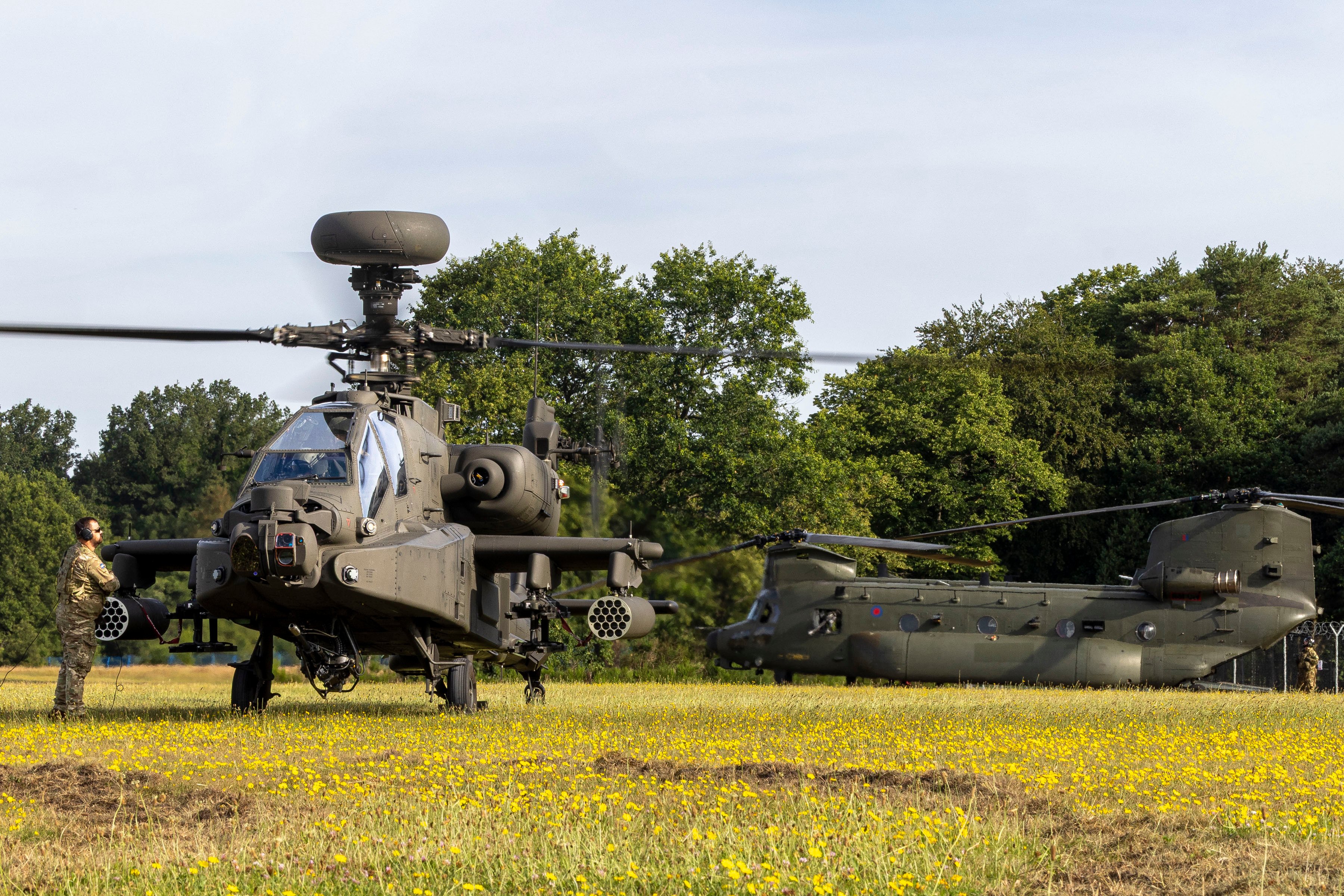 Pictured: A British Army Apache and RAF Chinook land at the Armed Forces Day national event in Aldershot on Saturday 27th June 2026. This prestigious national event brings the communities of Aldershot and Farnborough together with the military community in celebration and appreciation, through fantastic free activities, sports and entertainment. It is a chance for all to thank the Armed Forces for the vital role they play in protecting the nation. Service personnel from the Royal Navy, Royal Marines, Army, and Royal Air Force showcase the diverse mix of roles in the Armed Forces, demonstrating equipment, and highlighting their contribution to national security. Visitors are able to meet serving personnel, reservists, veterans, cadets, and military families during the weekend, which includes live military bands, parades and flypasts. The programme of activities also looks to the future by inspiring young people through displays, activities, sports, and family events.