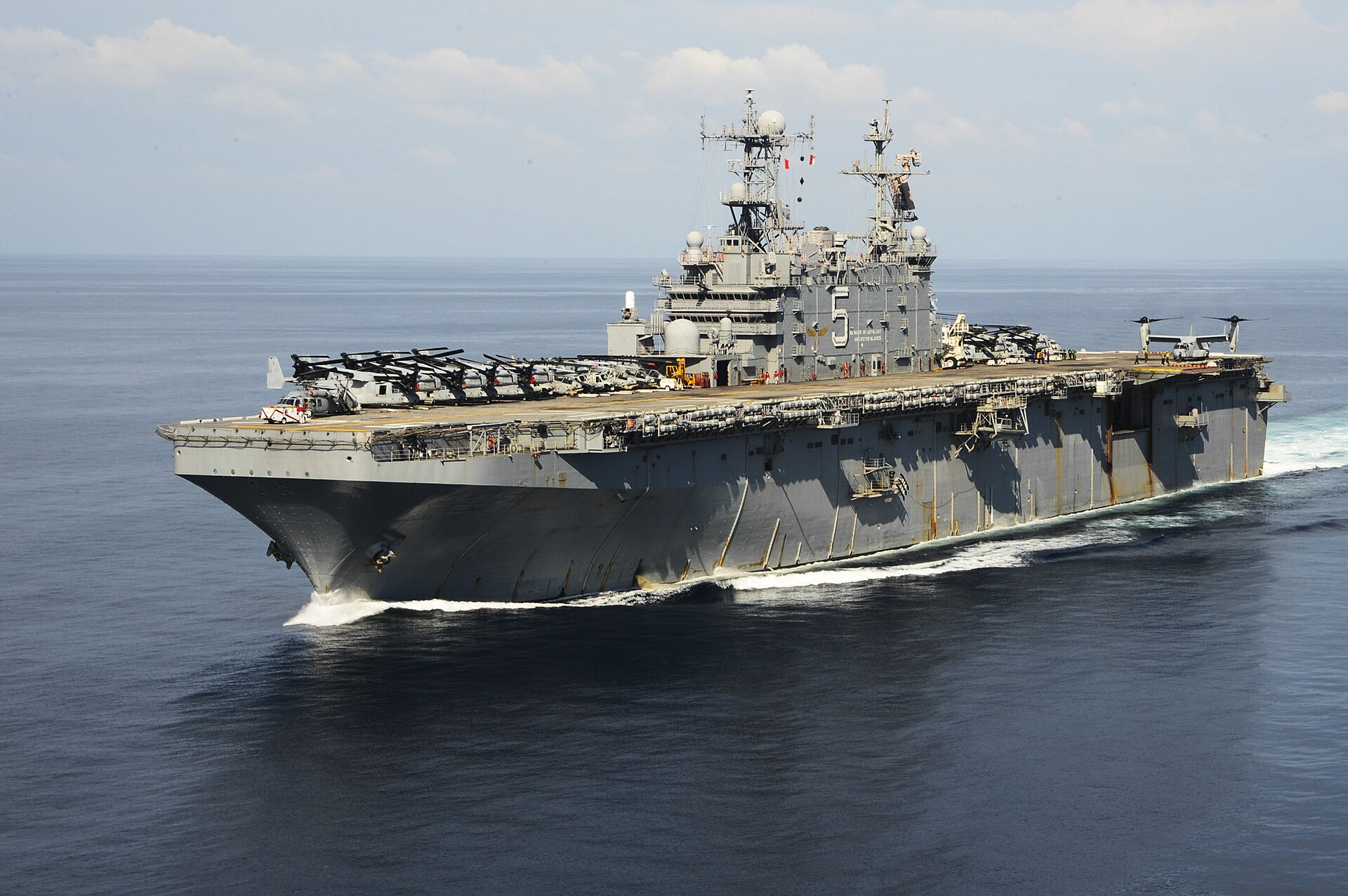 141022-N-NZ935-057PHILIPPINE SEA (Oct. 22, 2014) – The amphibious assault ship USS Peleliu (LHA 5) sails into open water as part of the Peleliu Amphibious Ready Group (PELARG). Peleliu is the lead ship in the PELARG (#PELARG14), commanded by Capt. Heidi Agle, and is conducting joint forces exercises in the U.S. 7th Fleet area of responsibility. (U.S. Navy Photo by Mass Communication Specialist 1st Class Joshua Hammond/Released)