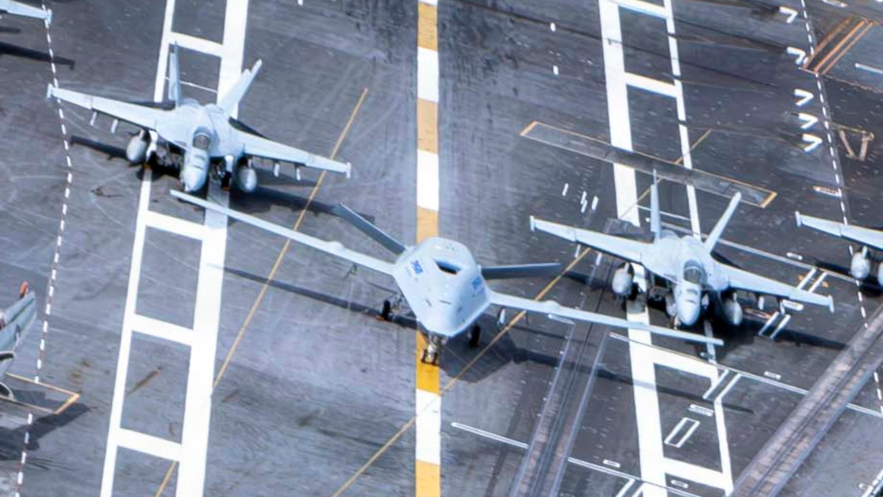 The images of T-1 Nimitz still underscore just how big even the demonstrator design is compared to other aircraft in the Navy's carrier air wings.