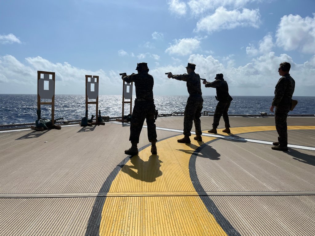 220509-N-N3764-0100 Caribbean Sea -- (May 9, 2022) -- Embarked Marines from Marine Corps Security Force Regiment Company Alpha 6 and Company Bravo 5, conduct a small arms gunshoot onboard Ship Special Mission Kellie Chouest, May 9, 2022. SSM Kellie Chouest is deployed to the U.S. 4th Fleet area of operations to support Joint Interagency Task Force South’s mission, which includes counter-illicit drug trafficking missions in the Caribbean and Eastern Pacific. (U.S. Navy photo by Lieutenant Ian Blankenship/Released)
