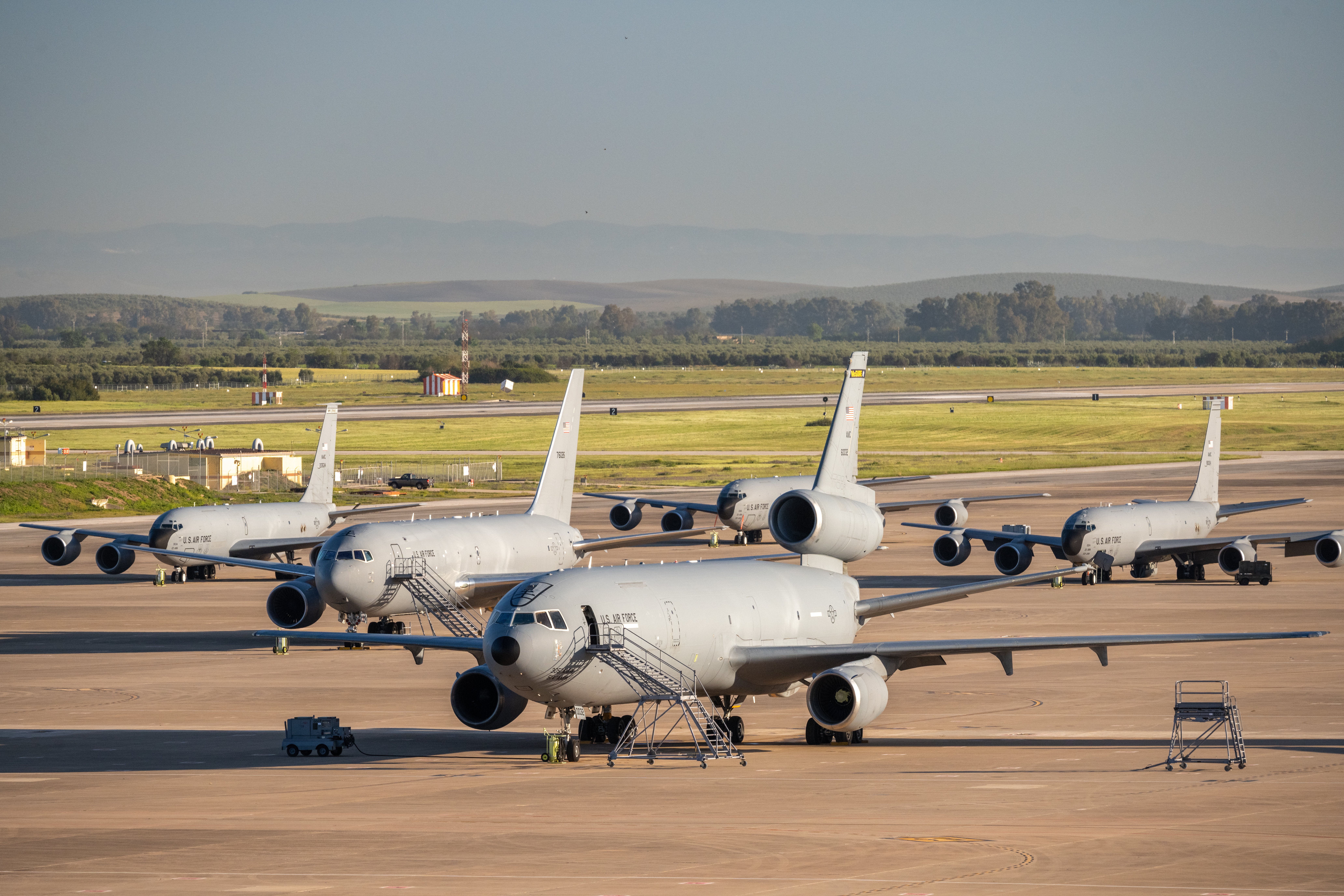 A KC-10, KC-46 and three KC-135s sit on the flight line at Morón Air Base, Spain on Thursday, April 14, 2022. The three airframes represent the entire might of the U.S. Air Force’s refueling arsenal and have a combined 110 years of service between them. (U.S. Air Force photo by Staff Sgt. Nathan Eckert)