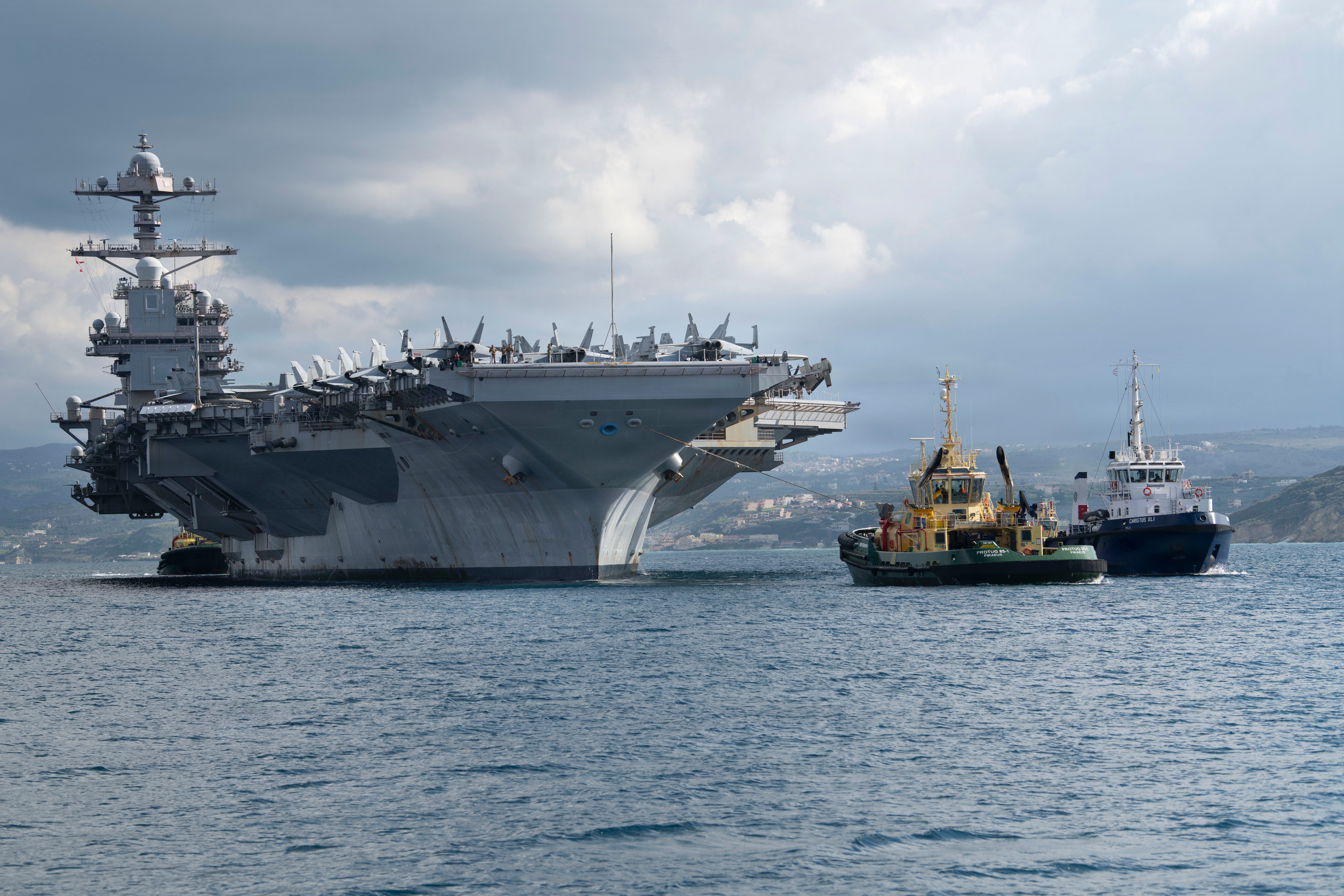 NAVAL SUPPORT ACTIVITY SOUDA BAY, Greece (Feb. 23, 2026) The world’s largest aircraft carrier, Ford-class aircraft carrier USS Gerald R. Ford (CVN 78) arrives at the NATO Marathi Pier Complex in Souda Bay, Crete, Greece, during a scheduled port visit on Feb. 23, 2026. NSA Souda Bay is an operational ashore installation that enables and supports U.S., Allied, Coalition, and partner nation forces to preserve security and stability in the European, African, and Central Command areas of responsibility. (U.S. Navy photo by Mass Communication Specialist 3rd Class Hannah Donahue)