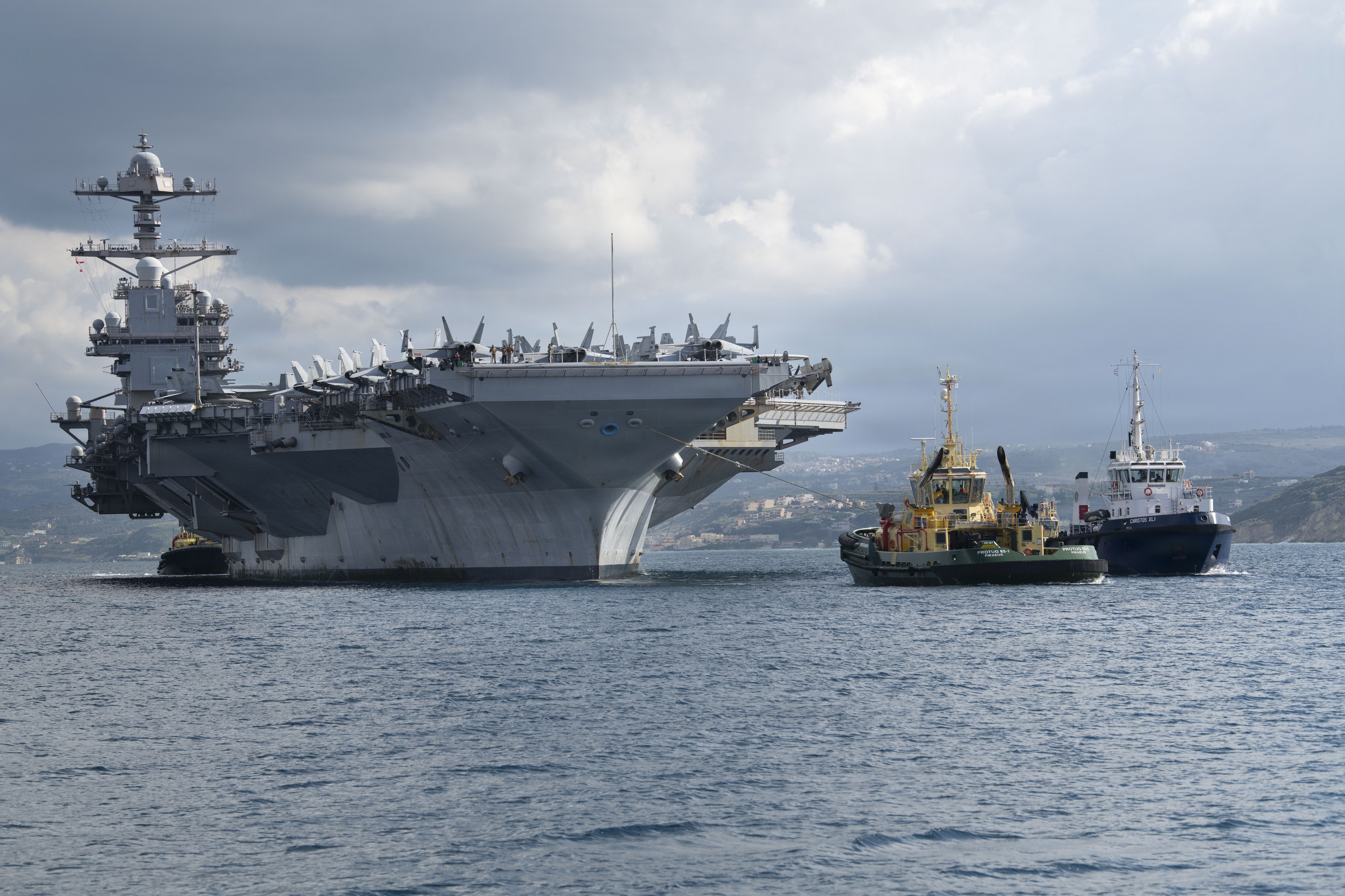 NAVAL SUPPORT ACTIVITY SOUDA BAY, Greece (Feb. 23, 2026) The world’s largest aircraft carrier, Ford-class aircraft carrier USS Gerald R. Ford (CVN 78) arrives at the NATO Marathi Pier Complex in Souda Bay, Crete, Greece, during a scheduled port visit on Feb. 23, 2026. NSA Souda Bay is an operational ashore installation that enables and supports U.S., Allied, Coalition, and partner nation forces to preserve security and stability in the European, African, and Central Command areas of responsibility. (U.S. Navy photo by Mass Communication Specialist 3rd Class Hannah Donahue)
