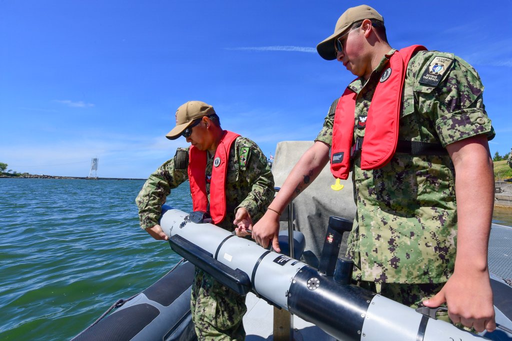 260610-N-HI500-1022 LIEPAJA, Latvia (June 10, 2026) - Electronics Technician, Submarine Navigation 1st Class Kenneth Mangahas, left, and Torpedoman's Mate 1st Class Gerardo Gonzalez, assigned to Unmanned Undersea Vehicle Group (UUVGRU) 1, prepare to launch an Iver3 Unmanned Underwater Vehicle (UUV) during exercise Baltic Operations (BALTOPS) 2026 in Liepaja, Latvia, June 10, 2026. BALTOPS 2026, the premiere maritime-focused exercise in the Baltic Sea region, provides a unique training opportunity to strengthen combined response capabilities critical to preserving freedom of navigation and security in the Baltic Sea. (U.S. Navy photo by Mass Communication Specialist 1st Class Brandie Nuzzi)