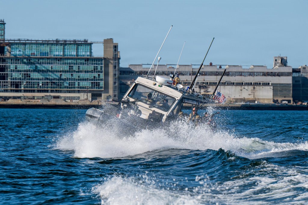 A 32-foot Transportable Port Security Boat splashes in the wake of a vessel while in pursuit during a simulated training exercise in San Francisco, March 14, 2026. The U.S. Coast Guard men and women train and prepare to respond to a crisis or contingency that may come without warning, including rescuing those in distress, responding to hurricanes or national incidents, and defending the nation as part of the armed forces. (U.S. Coast Guard photo by Petty Officer 3rd Class Austin Wiley)