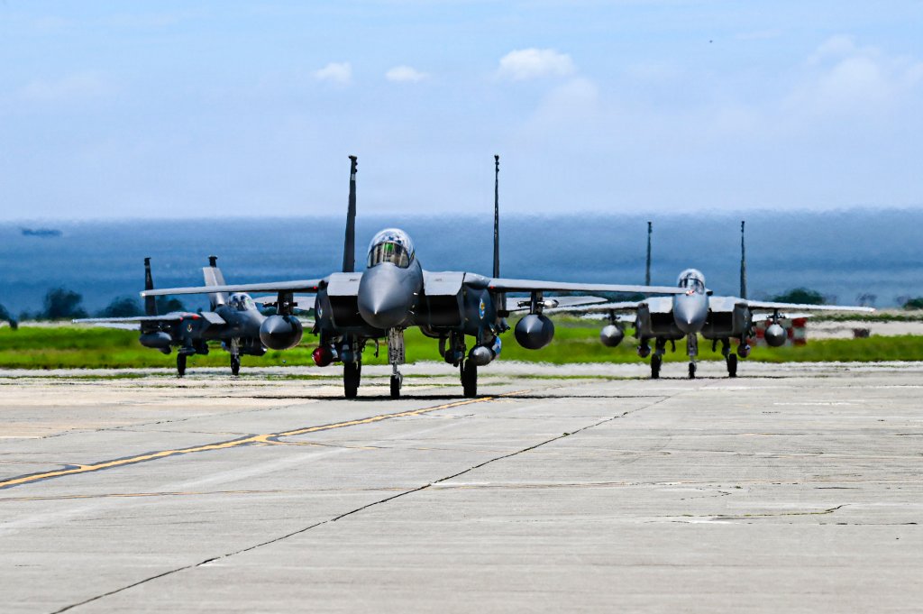 A U.S. Air Force F-15EX Eagle II and F-15E Strike Eagles assigned to 85th Test and Evaluation Squadron, Eglin Air Force Base, Florida, land at Kadena Air Base, Japan, June 29, 2026. The test aircraft arrival supported the Department of War's effort to modernize U.S. airpower in the Indo-Pacific and prepared Kadena personnel and the local community for the F-15EX's arrival. (U.S. Air Force photo by Airman 1st Class Gracelyn Hess)