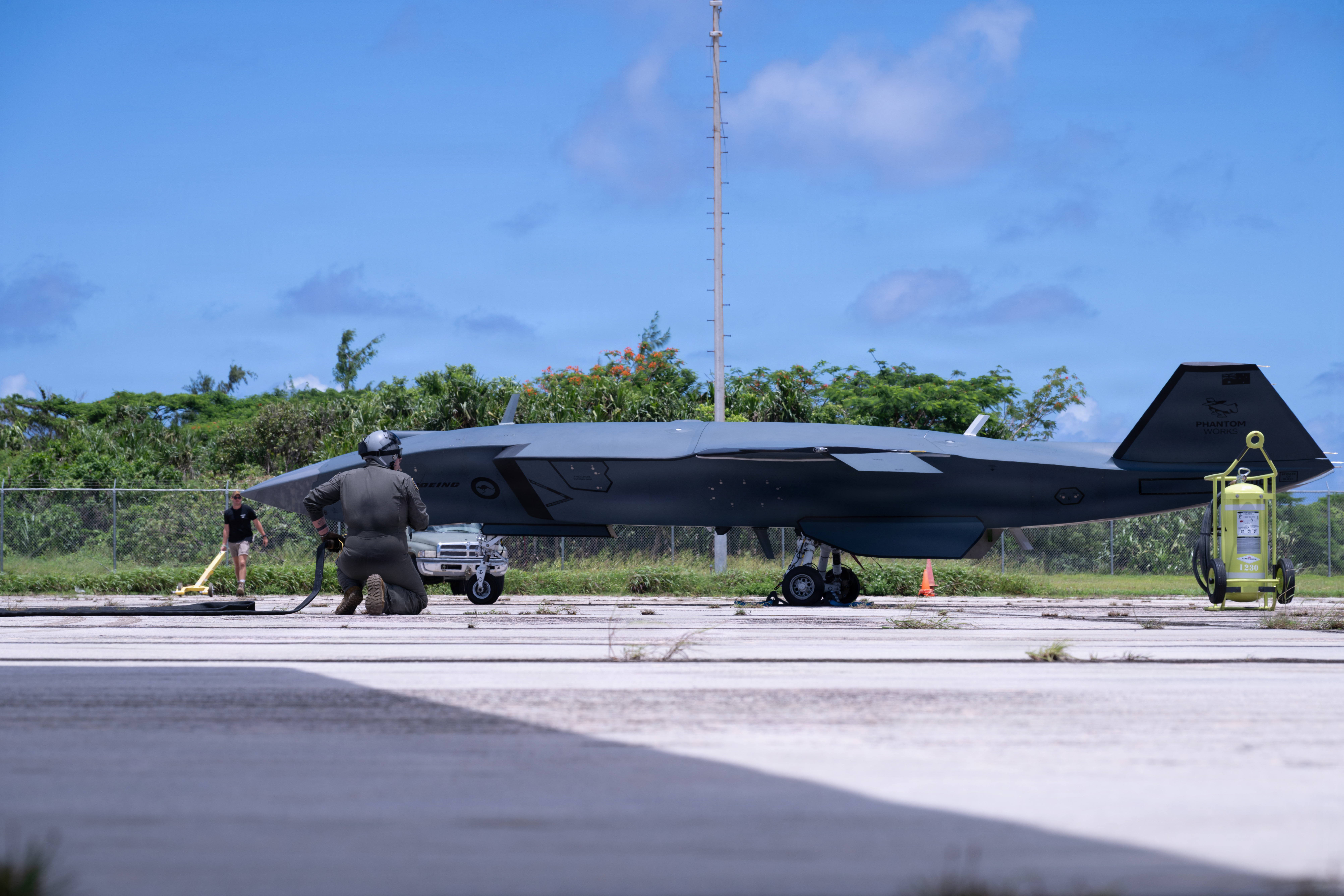 A U.S. Air Force HC-130J Combat King II and Airmen assigned to the 79th Rescue Squadron, alongside members of the Royal Australian Air Force and the Nellis Air Force Base-based Experimental Operations Unit, conduct a proof-of-concept Forward Arming and Refueling Point operation for Collaborative Combat Aircraft with the MQ-28 Ghost Bat in Rota, Commonwealth of the Northern Mariana Islands, June 28, 2026, in support of VALIANT SHIELD 2026. Exercises like VALIANT SHIELD allow Pacific Command Joint Forces the opportunity to integrate forces from all branches of service and with our allies to conduct precise, lethal, and overwhelming multi-axis, multi-domain effects that demonstrate the strength and versatility of the joint force and our commitment to a free and open Indo-Pacific. (U.S. Air Force photo by Senior Airman Austin Salazar)
