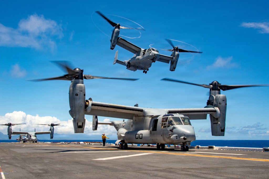 U.S. Marine Corps MV-22B Ospreys, attached to Marine Medium Tiltrotor Squadron (VMM) 164 (Reinforced), 15th Marine Expeditionary Unit, take off from Wasp-class amphibious assault ship USS Essex (LHD 2) with multinational military and civilian leaders following a tour of Essex in the Pacific Ocean as part of Exercise Rim of the Pacific 2026, July 15, 2026. Thirty nations, 30 ships, five submarines, 15 national land forces, more than 190 aircraft and more than 30,000 personnel are participating in RIMPAC in and around the Hawaiian Islands, June 24 to July 31. The world's largest international maritime exercise, RIMPAC provides a unique training opportunity while fostering and sustaining cooperative relationships among participants critical to ensuring the safety of sea lanes and security on the world's oceans. RIMPAC 2026 is the 30th exercise in the series that began in 1971. (U.S. Navy photo by Mass Communication Specialist Zachary Warr)