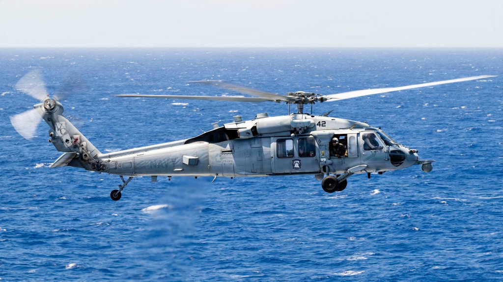 A U.S. Navy MH-60S Sea Hawk, assigned to Helicopter Sea Combat Squadron (HSC) 23, prepares to land on the flight deck of Nimitz-class aircraft carrier USS Theodore Roosevelt (CVN 71) during Exercise Rim of the Pacific 2026 in the Pacific Ocean, July 18, 2026. Thirty nations, 30 ships, five submarines, 15 national land forces, more than 190 aircraft and more than 30,000 personnel are participating in RIMPAC in and around the Hawaiian Islands, June 24 to July 31. The world's largest international maritime exercise, RIMPAC provides a unique training opportunity while fostering and sustaining cooperative relationships among participants critical to ensuring the safety of sea lanes and security on the world's oceans. RIMPAC 2026 is the 30th exercise in the series that began in 1971. (U.S. Navy photo by Mass Communication Specialist 3rd Class Adam Barnett)