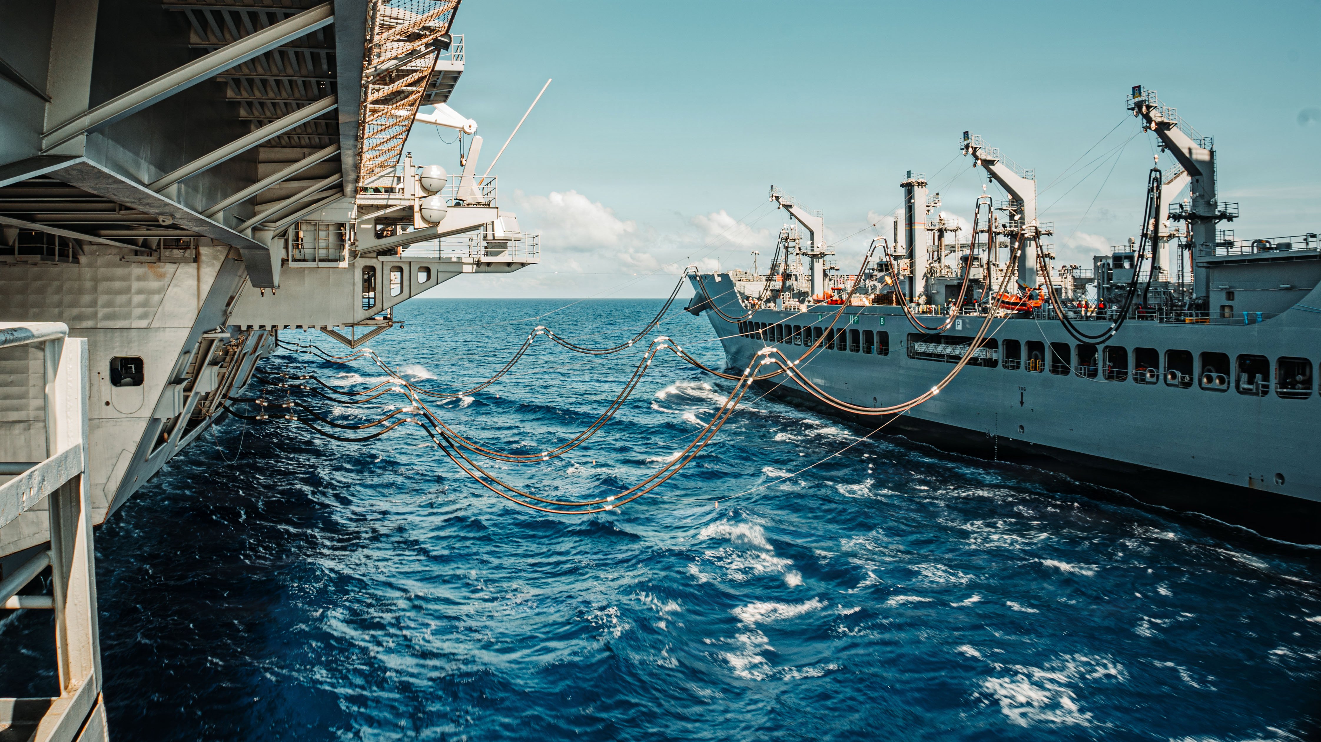 Nimitz-class aircraft carrier USS George Washington (CVN 73) during a fueling-at-sea evolution in the Philippine Sea, July 18, 2026. The George Washington Carrier Strike Group is operating in the U.S. 7th Fleet area of operations. George Washington is the U.S. Navy’s premiere forward-deployed aircraft carrier, a long-standing symbol of the United States’ commitment to maintaining a free and open Indo-Pacific, while operating alongside allies and partners across the U.S. Navy’s largest numbered fleet. (U.S. Navy photo by Mass Communication Specialist 2nd Class Tyler Crowley)