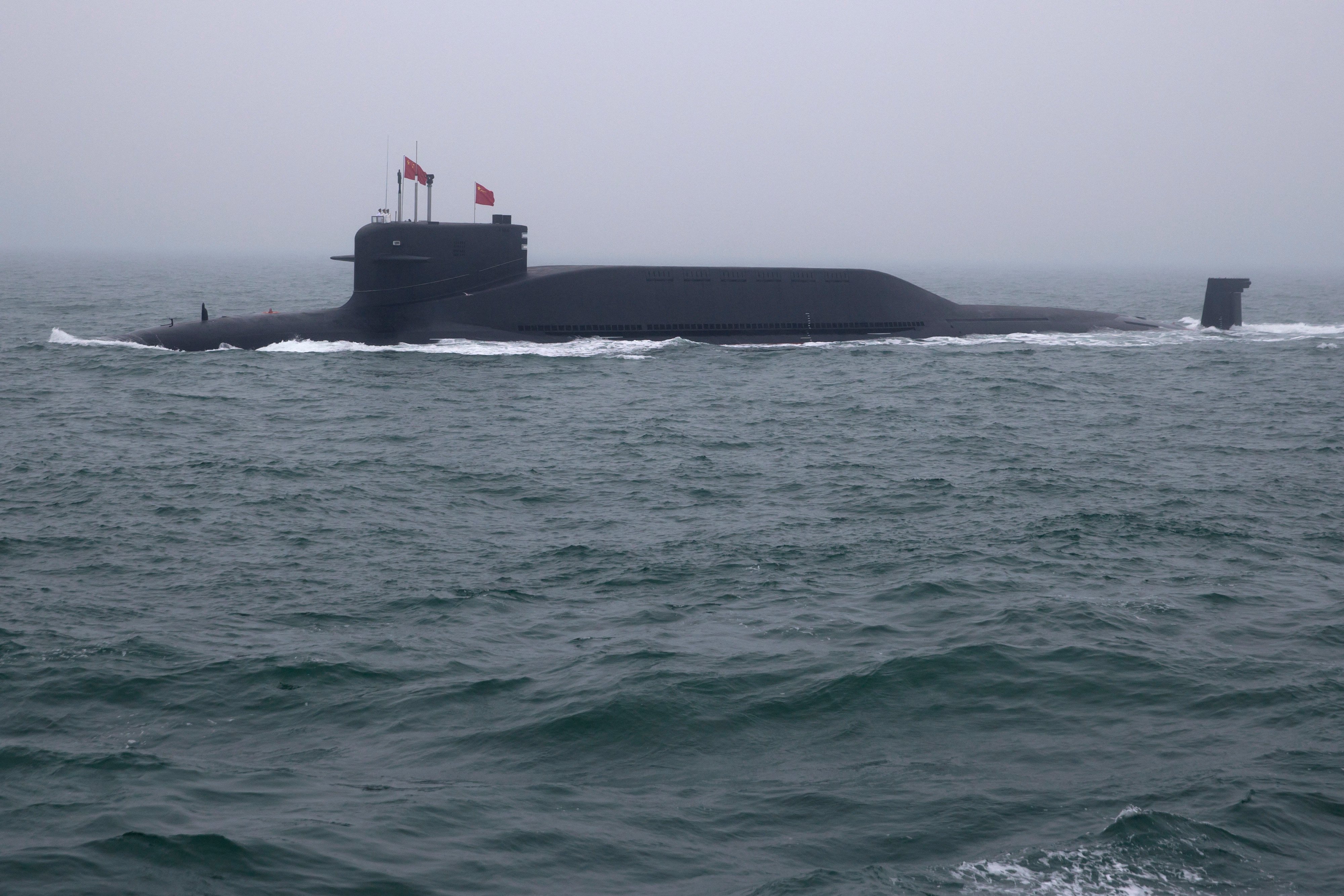 A type 094 Jin-class nuclear submarine Long March 15 of the Chinese People's Liberation Army (PLA) Navy participates in a naval parade to commemorate the 70th anniversary of the founding of China's PLA Navy in the sea near Qingdao, in eastern China's Shandong province on April 23, 2019. China celebrated the 70th anniversary of its navy by showing off its growing fleet in a sea parade featuring a brand new guided-missile destroyer. (Photo by Mark Schiefelbein / POOL / AFP) (Photo by MARK SCHIEFELBEIN/POOL/AFP via Getty Images)
