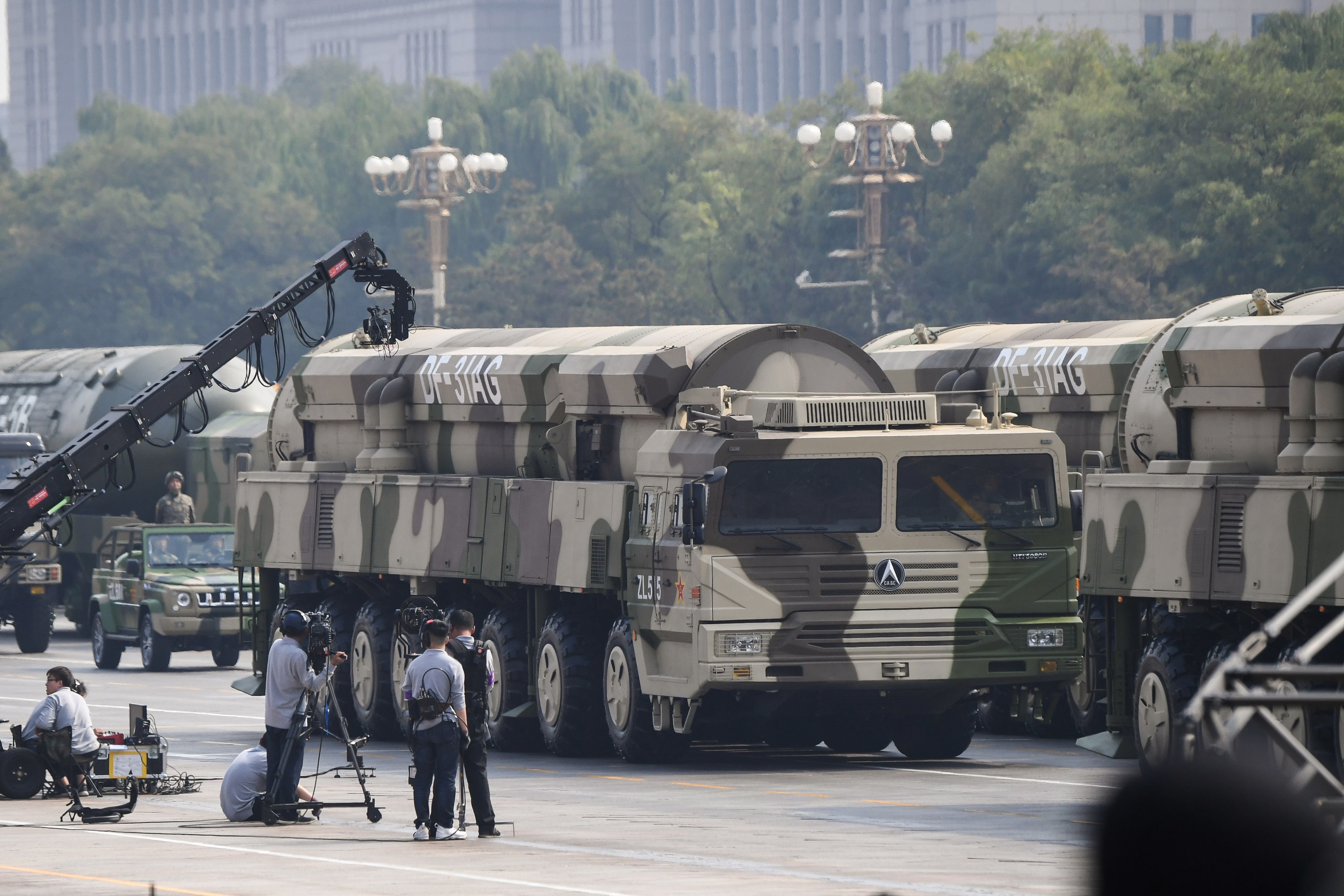 Military vehicles carrying DF-31AG intercontinental ballistic missiles participate in a military parade at Tiananmen Square in Beijing on October 1, 2019, to mark the 70th anniversary of the founding of the Peoples Republic of China. (Photo by GREG BAKER / AFP) (Photo credit should read GREG BAKER/AFP via Getty Images)