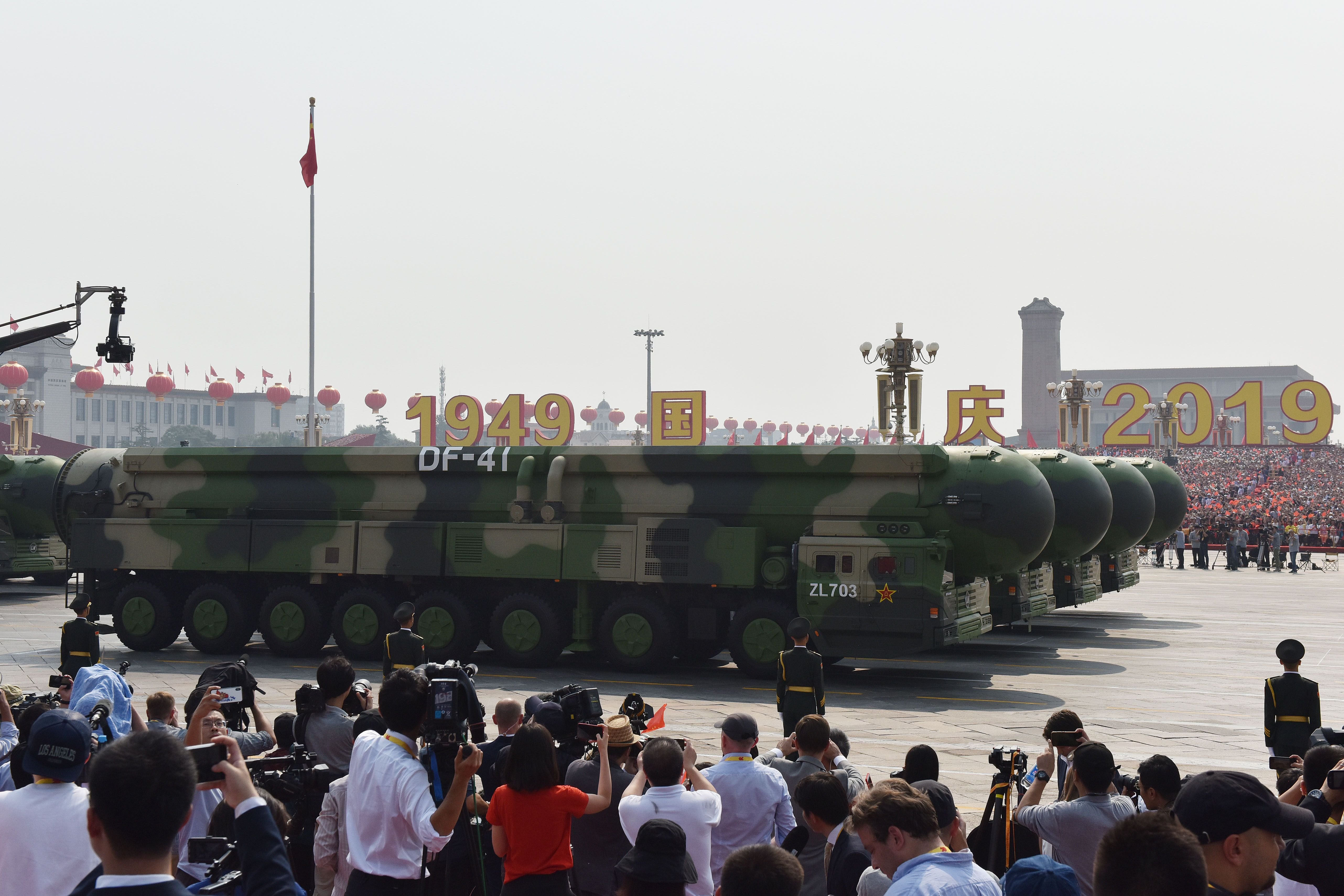 Military vehicles carry China's DF-41 nuclear-capable intercontinental ballistic missiles in a military parade at Tiananmen Square in Beijing on October 1, 2019, to mark the 70th anniversary of the founding of the People's Republic of China. (Photo by GREG BAKER / AFP) (Photo by GREG BAKER/AFP via Getty Images)