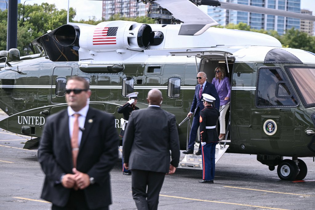 US President Joe Biden and First Lady Jill Biden step off of Marine One, the new model Sikorsky VH-92A, upon arrival at Soldier Field Landing zone in Chicago, Illinois, on August 19, 2024. President Biden is delivering the keynote address at the Democratic National Convention opening night. (Photo by Brendan SMIALOWSKI / AFP) (Photo by BRENDAN SMIALOWSKI/AFP via Getty Images)