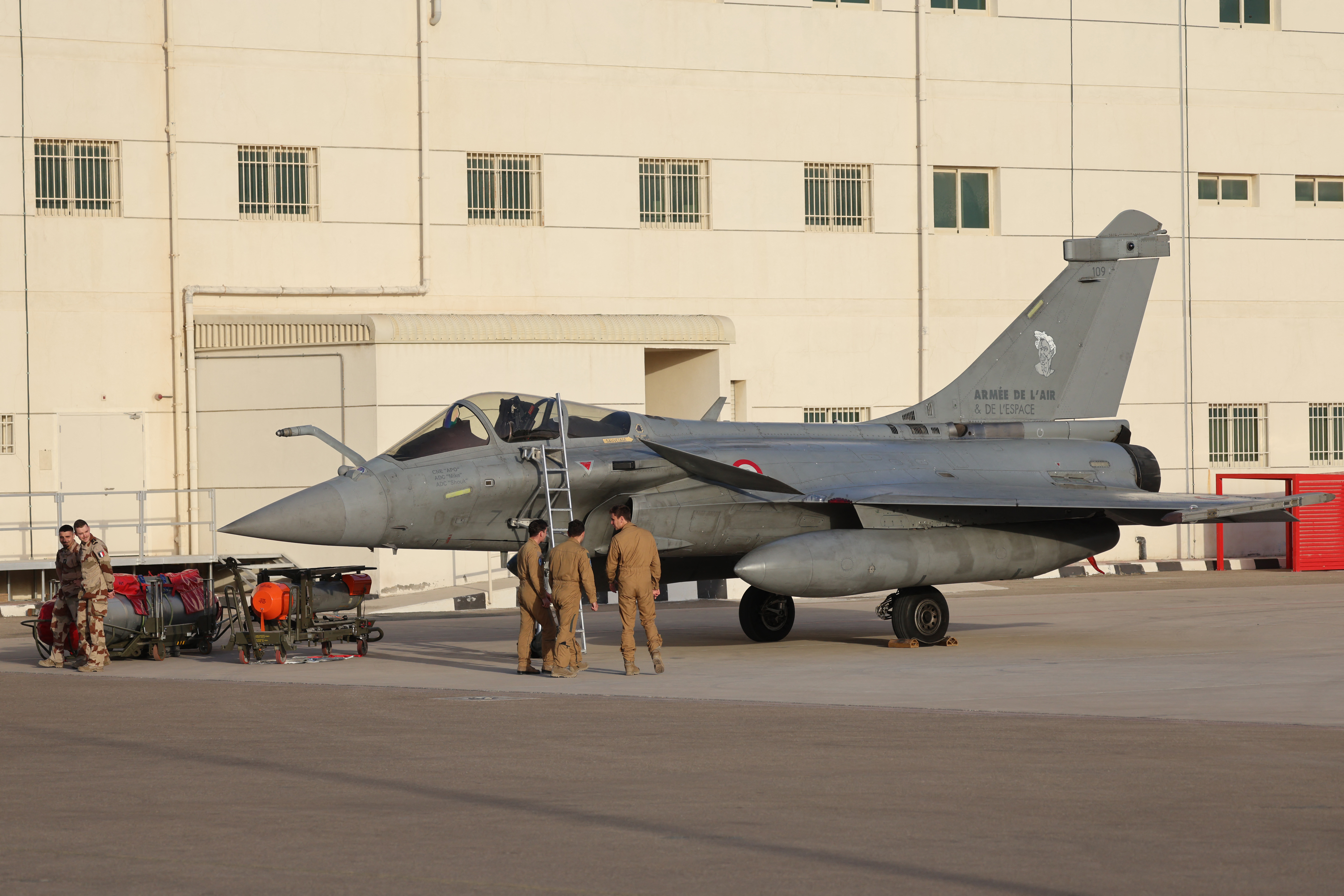 Air Force pilots from 104 French Air Base prepare the French Rafale fighter jet to take off for a training exercise at the air base of Al Dhafra, near Abu Dhabi on December 20, 2025. (Photo by Ludovic MARIN / AFP via Getty Images)