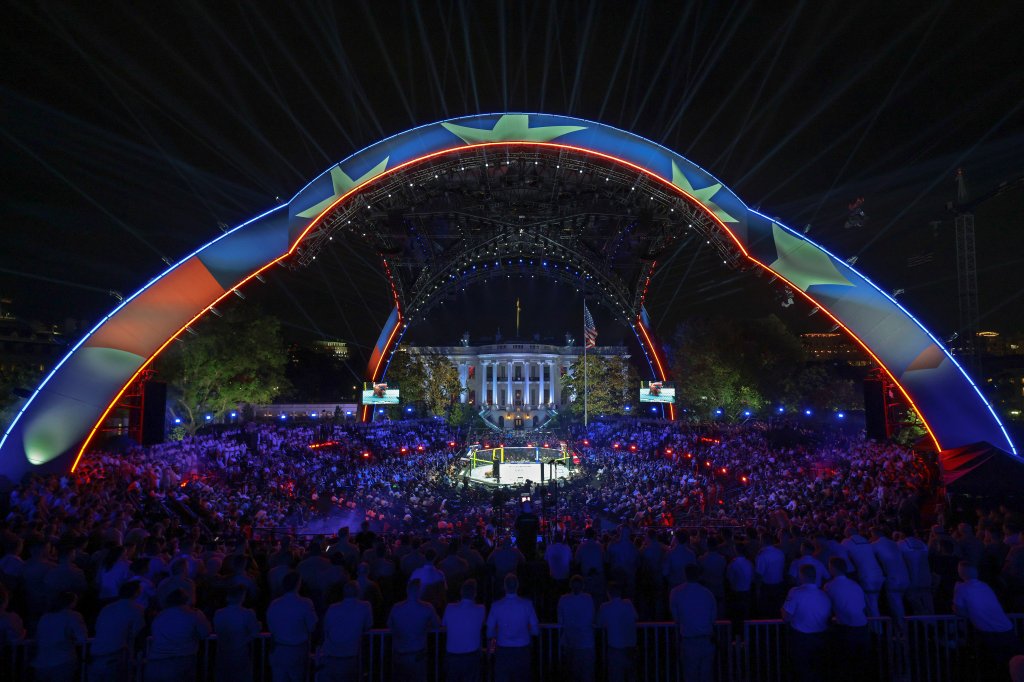 WASHINGTON, DC - JUNE 14: Guests, including members of the U.S. military, attend the Ultimate Fighting Championship (UFC) Freedom 250 mixed martial arts event under the open-air