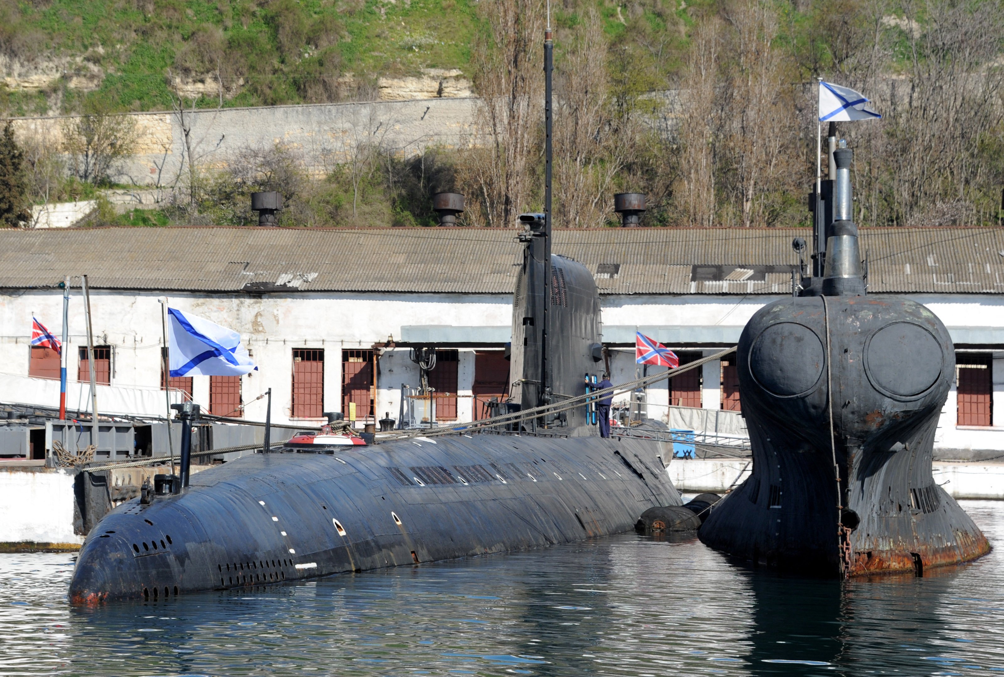 Russian submarines are moored in the bay of the Crimean city of Sevastopol on March 23, 2014. Crimea's rebel leader urged Russians across Ukraine on Sunday to rise up against Kiev's rule and welcome Kremlin forces whose unrelenting march against his flashpoint peninsula has defied Western outrage. AFP PHOTO/ VIKTOR DRACHEV (Photo by VIKTOR DRACHEV / AFP) (Photo by VIKTOR DRACHEV/AFP via Getty Images)