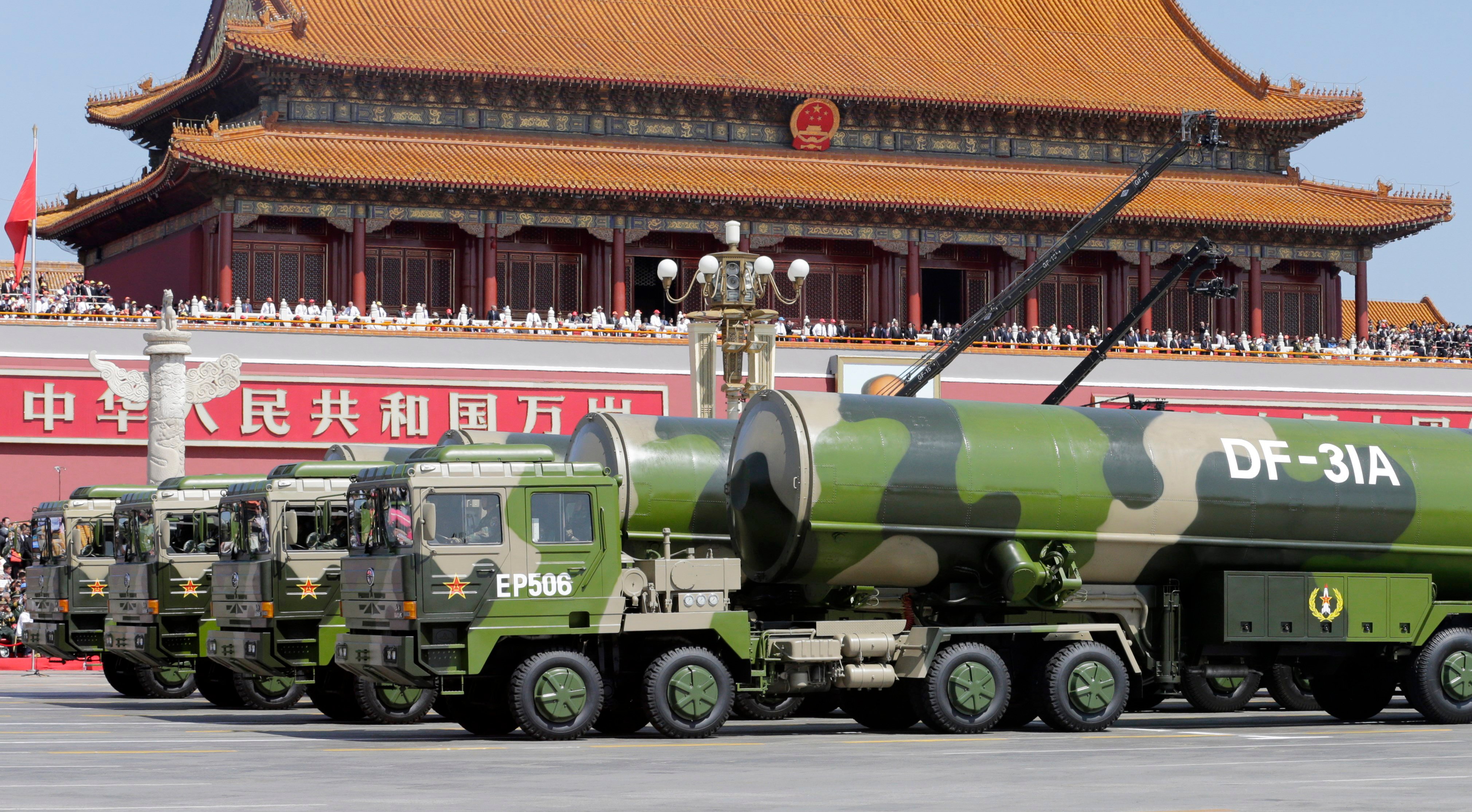 BEIJING, CHINA - SEPTEMBER 03: Military vehicles carrying DF-31A long-range missiles drive past the Tiananmen Gate during a military parade to mark the 70th anniversary of the end of World War Two on September 3, 2015 in Beijing, China. China is marking the 70th anniversary of the end of World War II and its role in defeating Japan with a new national holiday and a military parade in Beijing. (Photo by Jason Lee - Pool/Getty Images)