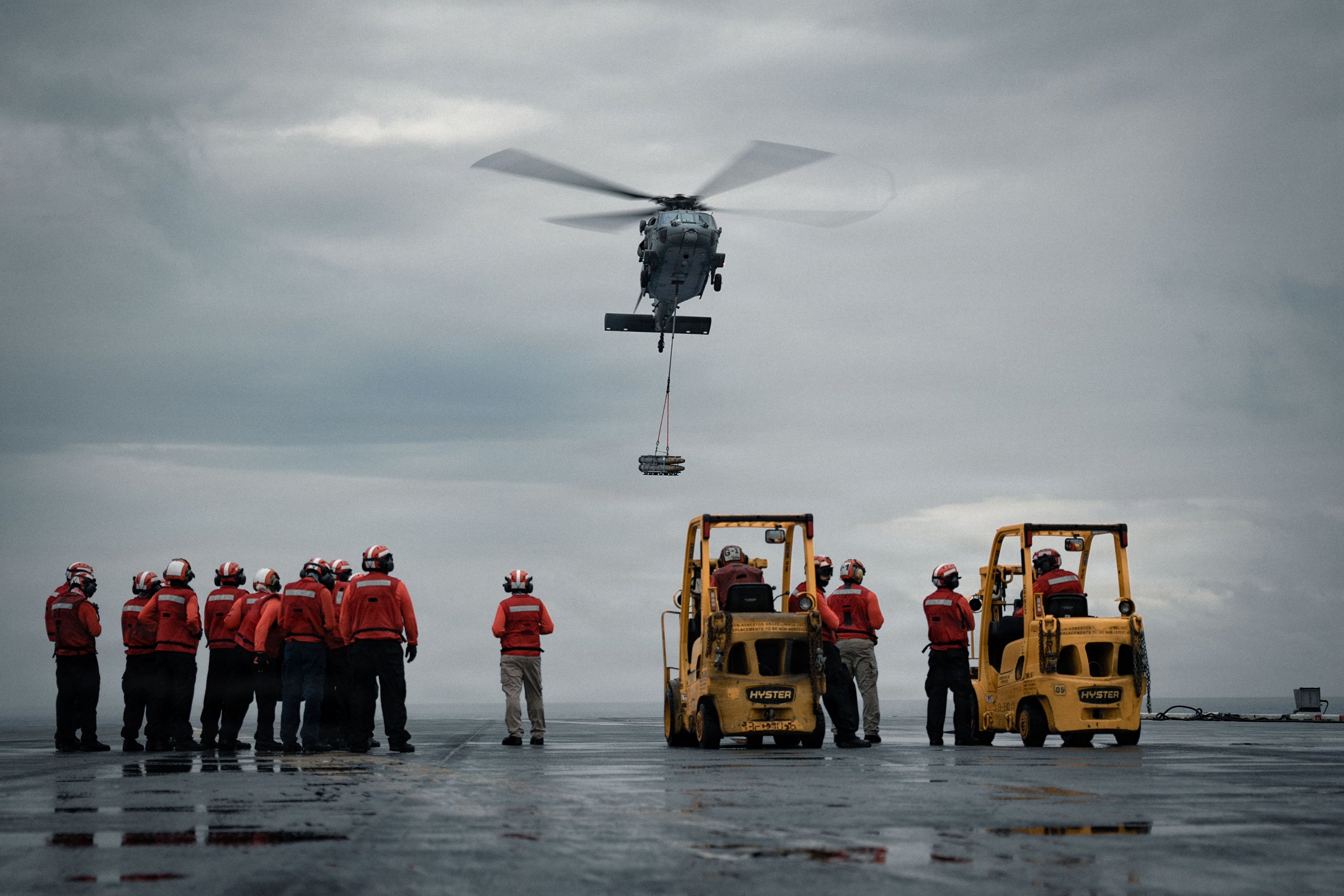 An MH-60S Seahawk, attached to the “Dragonslayers” of Helicopter Sea Combat Squadron (HSC) 11, approaches the flight deck while transporting ammunition aboard Nimitz-class aircraft carrier USS Dwight D. Eisenhower (CVN 69), July 24, 2026. Eisenhower is underway in the Atlantic Ocean conducting ammunition onload. (U.S. Navy photo by Mass Communication Specialist 2nd Class Miguel Santiago)