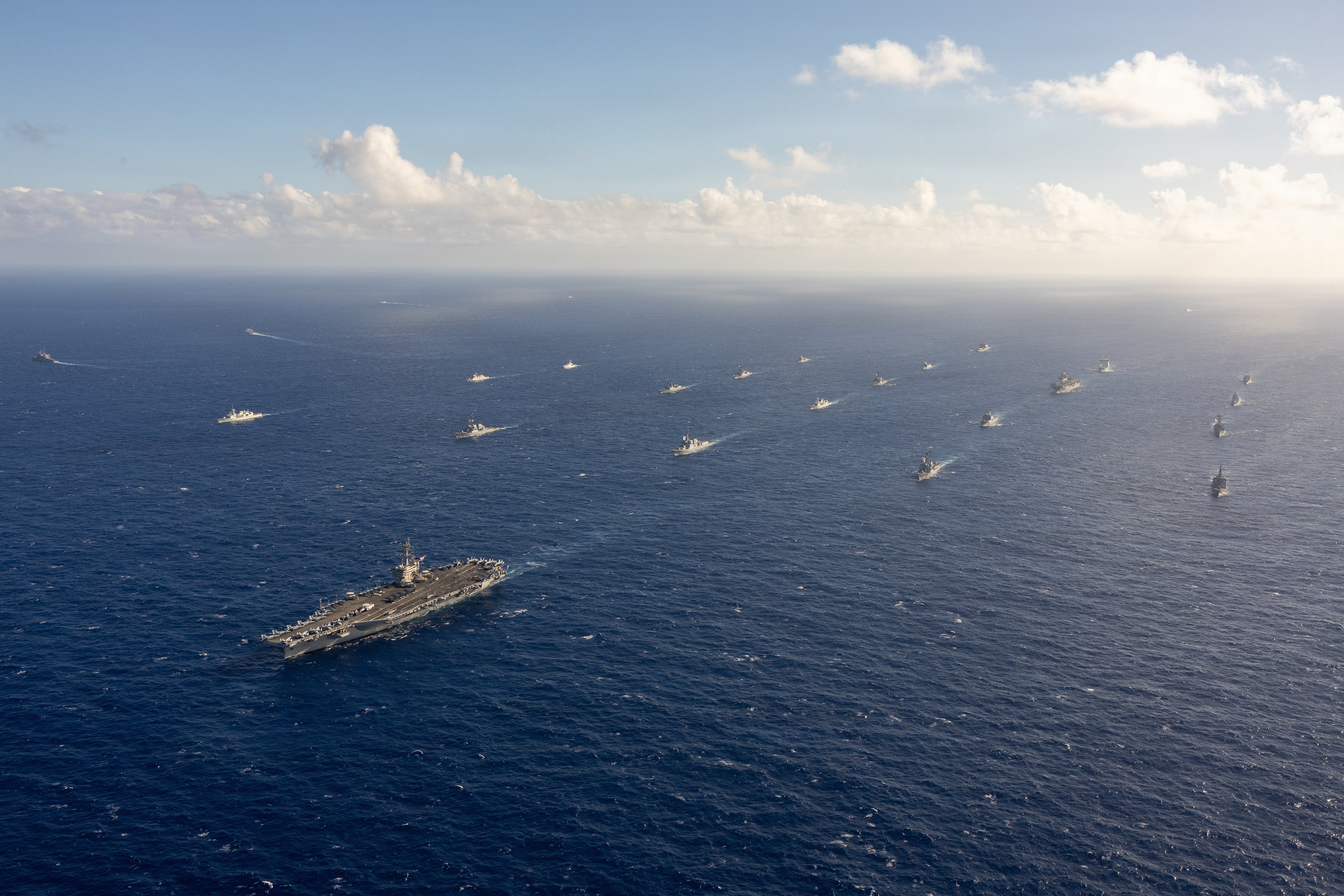 The Nimitz-class aircraft carrier USS Theodore Roosevelt (CVN 71) leads a group sail July 22, 2026, in the Pacific Ocean off the coast of Hawaii during Exercise Rim of the Pacific 2026. Thirty nations, 30 ships, five submarines, 15 national land forces, more than 190 aircraft and more than 30,000 personnel are participating in RIMPAC in and around the Hawaiian Islands, June 24 to July 31. The world's largest international maritime exercise, RIMPAC provides a unique training opportunity while fostering and sustaining cooperative relationships among participants critical to ensuring the safety of sea lanes and security on the world's oceans. RIMPAC 2026 is the 30th exercise in the series that began in 1971.