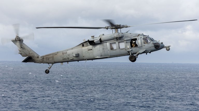 The search is on for a missing crewmember after an MH-60S Seahawk helicopter crashed into the Arabian Sea.