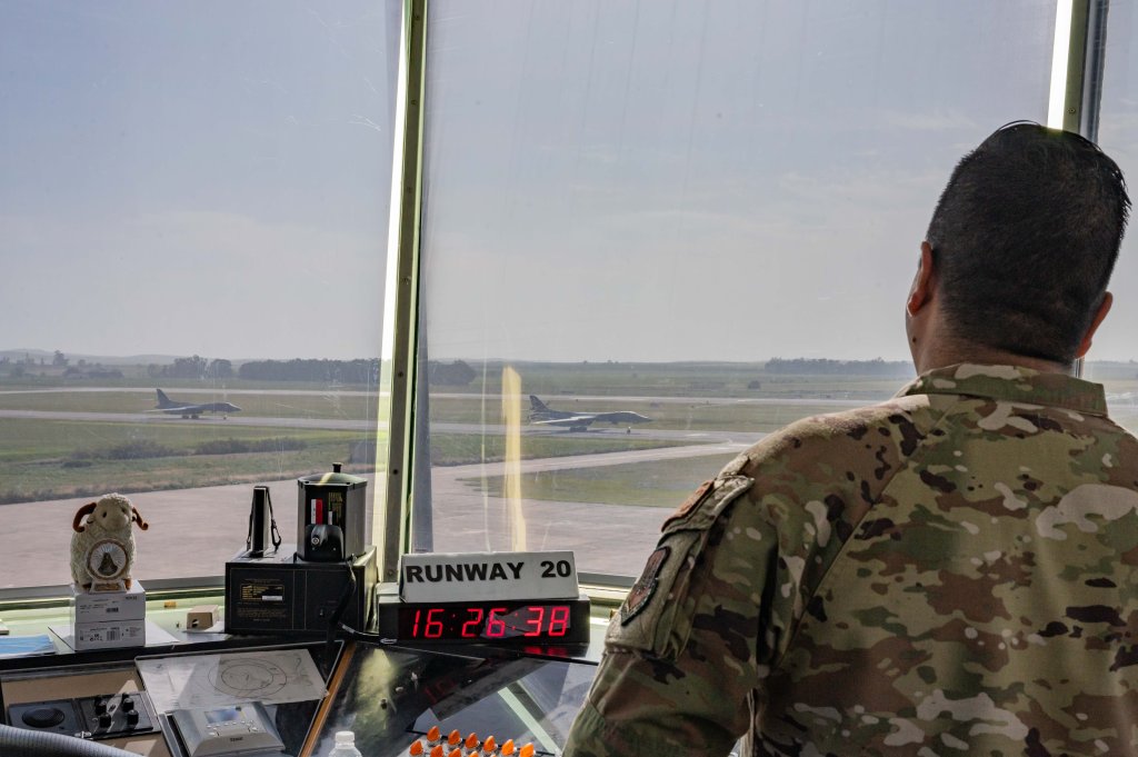 U.S. Air Force Staff Sgt. Arturo Herrera, 496th Air Base Squadron Operational Support Team tower watch supervisor, observes two B-1B Lancers taxiing at Morón Air Base, Spain, April 17, 2024. U.S. Air Force air traffic controllers assigned to the 496th ABS work alongside Spanish air traffic control allies and are required to attend the Defense Language Institute Foreign Language Center for Spanish before arriving at Morón AB. (U.S. Air Force photo by Airman 1st Class Eve Daugherty)