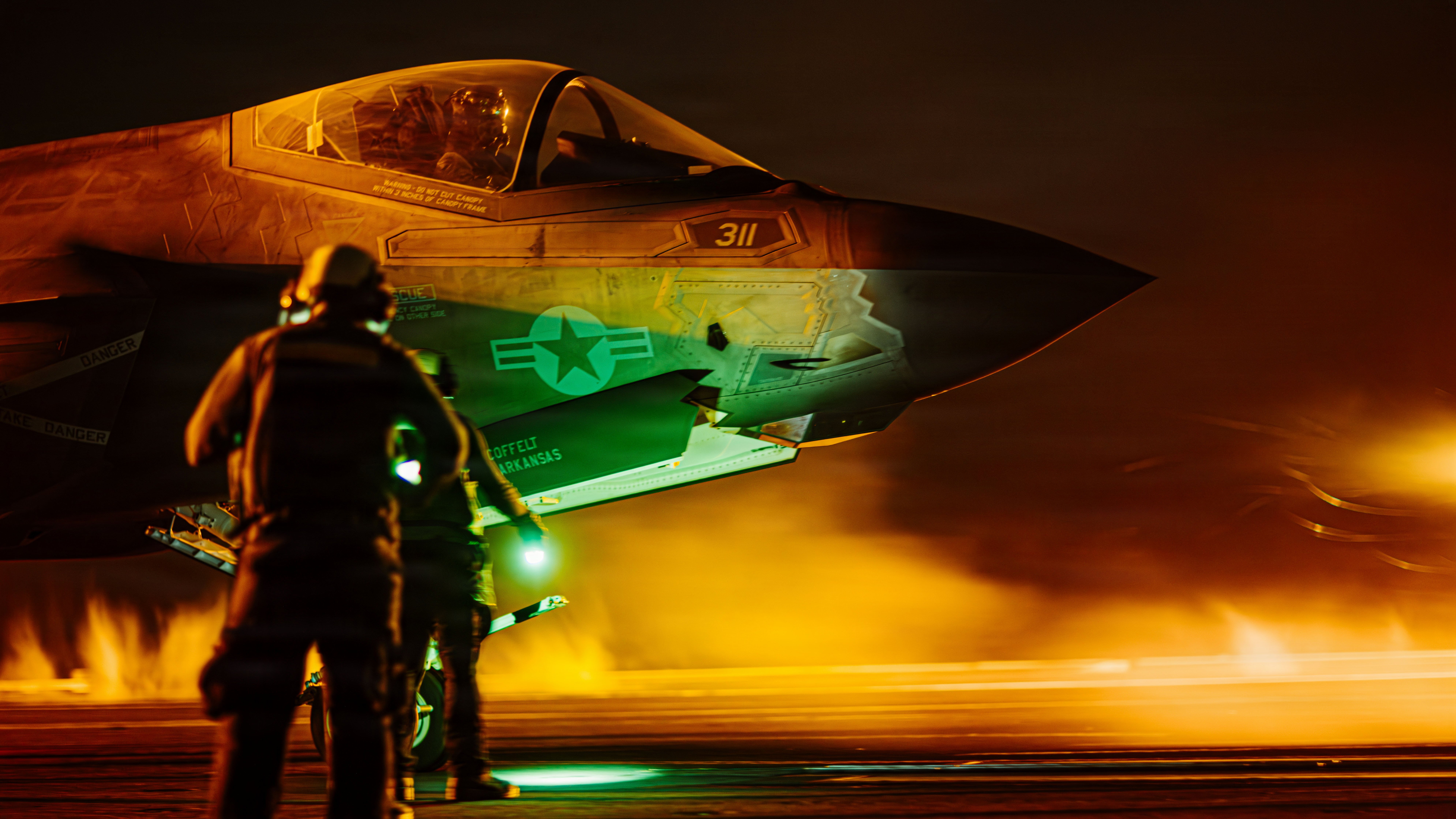 U.S. Sailors signal an F-35C Lightning II, attached to Strike Fighter Squadron (VFA) 147, on the flight deck of Nimitz-class aircraft carrier USS George Washington (CVN 73), Aug. 28, 2026. George Washington is deployed to the U.S. 5th Fleet area of operations to support maritime security and stability in the Middle East. (U.S. Navy photo)