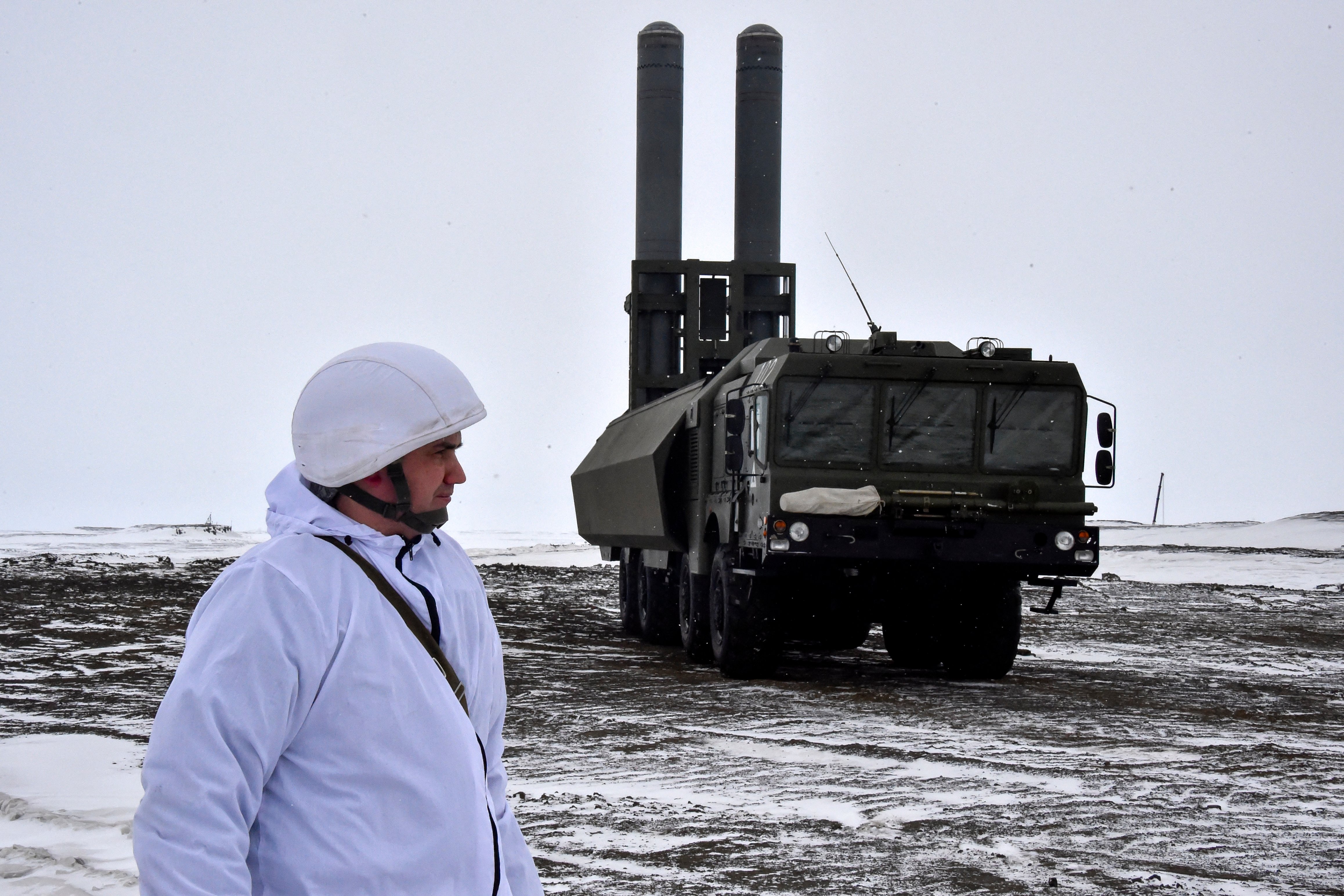A serviceman stands near a Russia's Bastion mobile coastal defence missile system on the island of Alexandra Land, which is part of the Franz Josef Land archipelago, on May 17, 2021. (Photo by Maxime POPOV / AFP) (Photo by MAXIME POPOV/AFP via Getty Images)