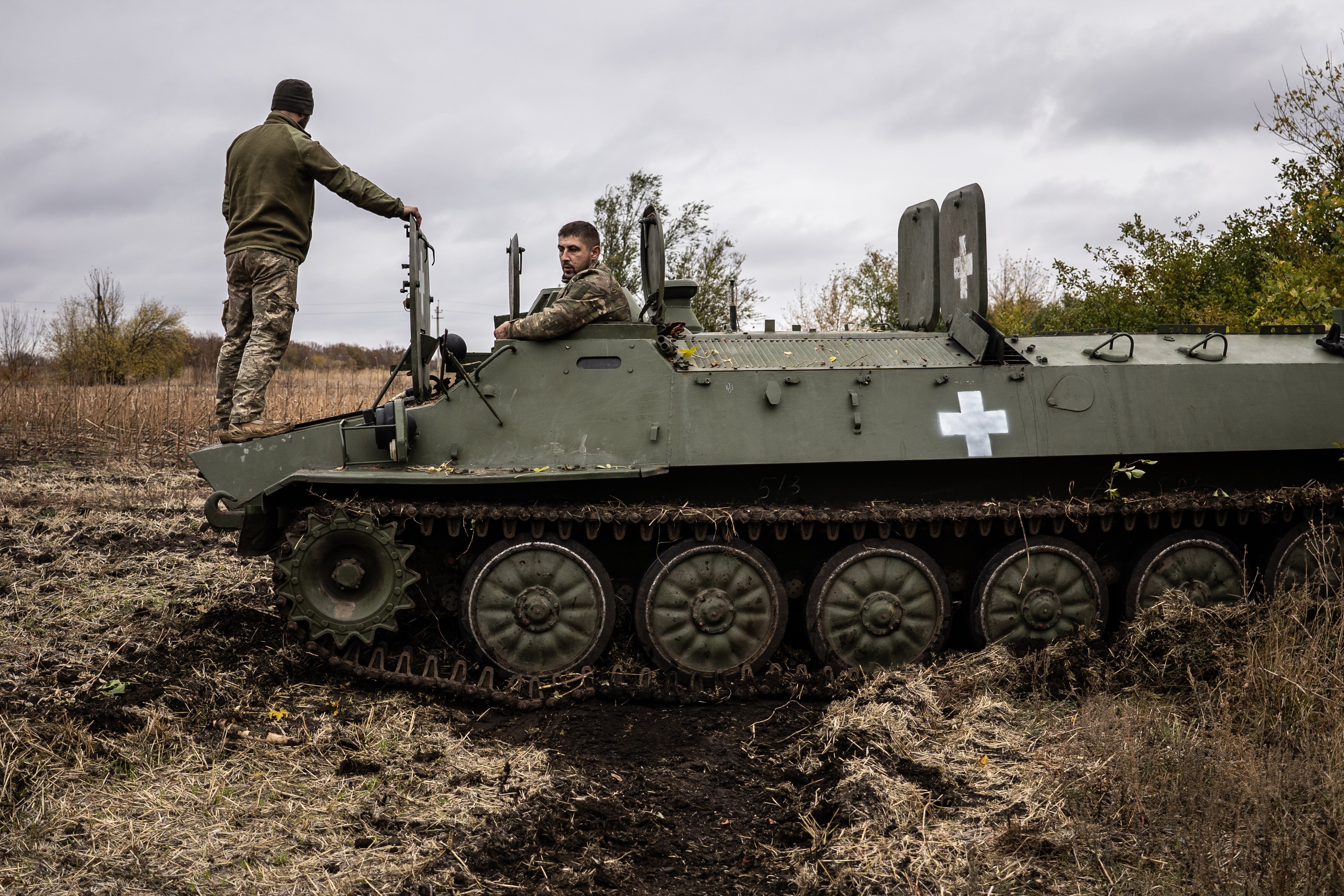  Two Ukrainian army mechanics repair a broken MT-LB (light armored multi-purpose towing vehicle) in the Donetsk region in Kharkiv, Ukraine on October 25, 2024. Originally designed in the 1960s during the Soviet era, the vehicle entered service a decade later and was manufactured in Kharkiv. (Photo by Fermin Torrano/Anadolu via Getty Images)