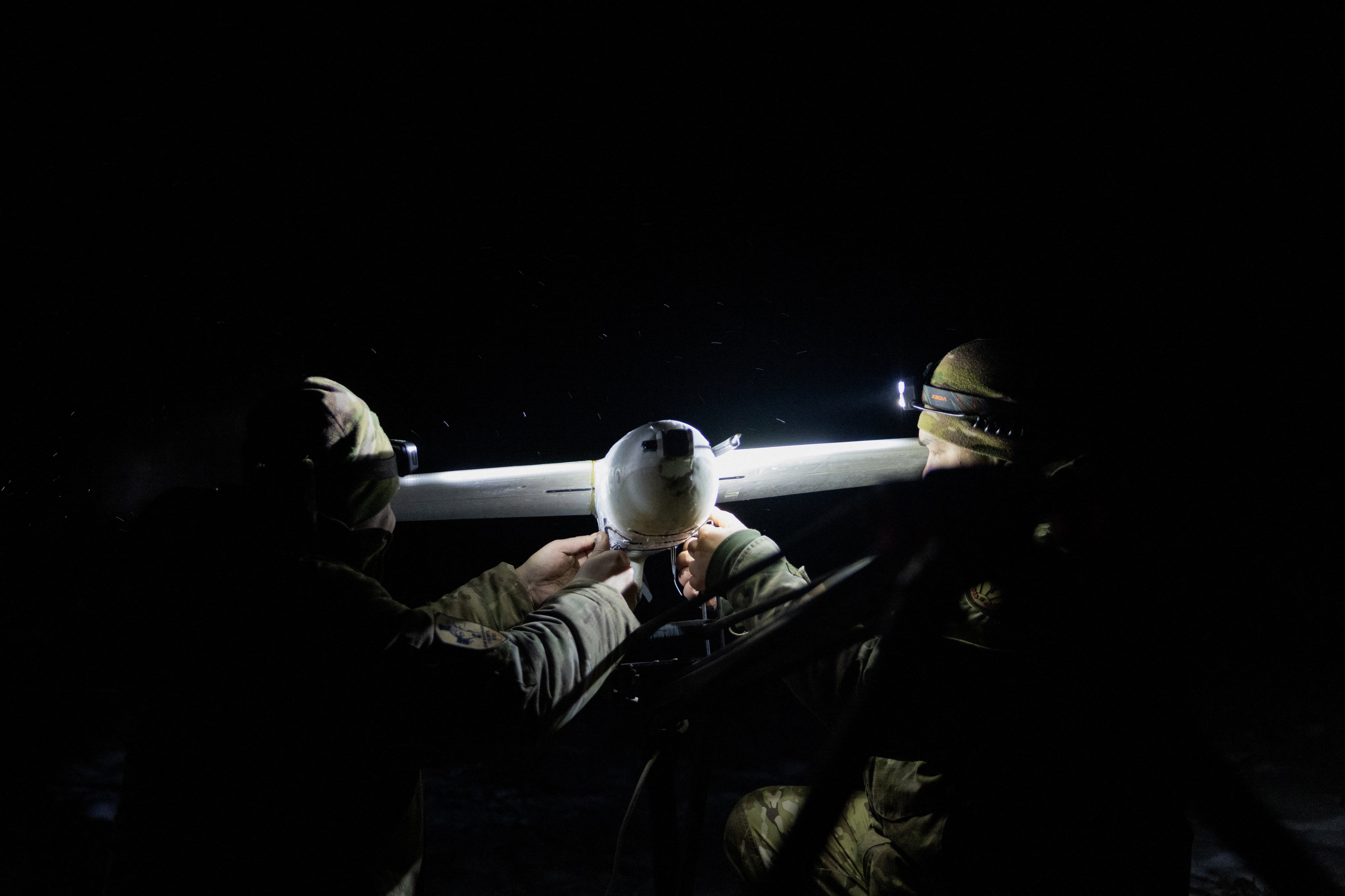 Ukrainian servicemen of the 18th Sloviansk Brigade of the National Guard of Ukraine prepare to launch a drone interceptor to engage enemy targets in the Donetsk region on January 22, 2026, amid the Russian invasion of Ukraine. (Photo by Tetiana DZHAFAROVA / AFP via Getty Images)
