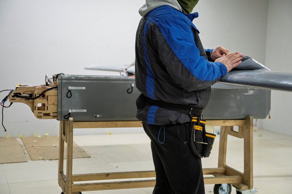 An employee assembles a long-range drone in a workshop of the Fire Point company which manufactures FP-1 deep-strike drones and FP-2 strike drones in an undisclosed location in Ukraine on January 29, 2026, amid the Russian invasion of Ukraine. (Photo by Serhii Okunev / AFP via Getty Images)