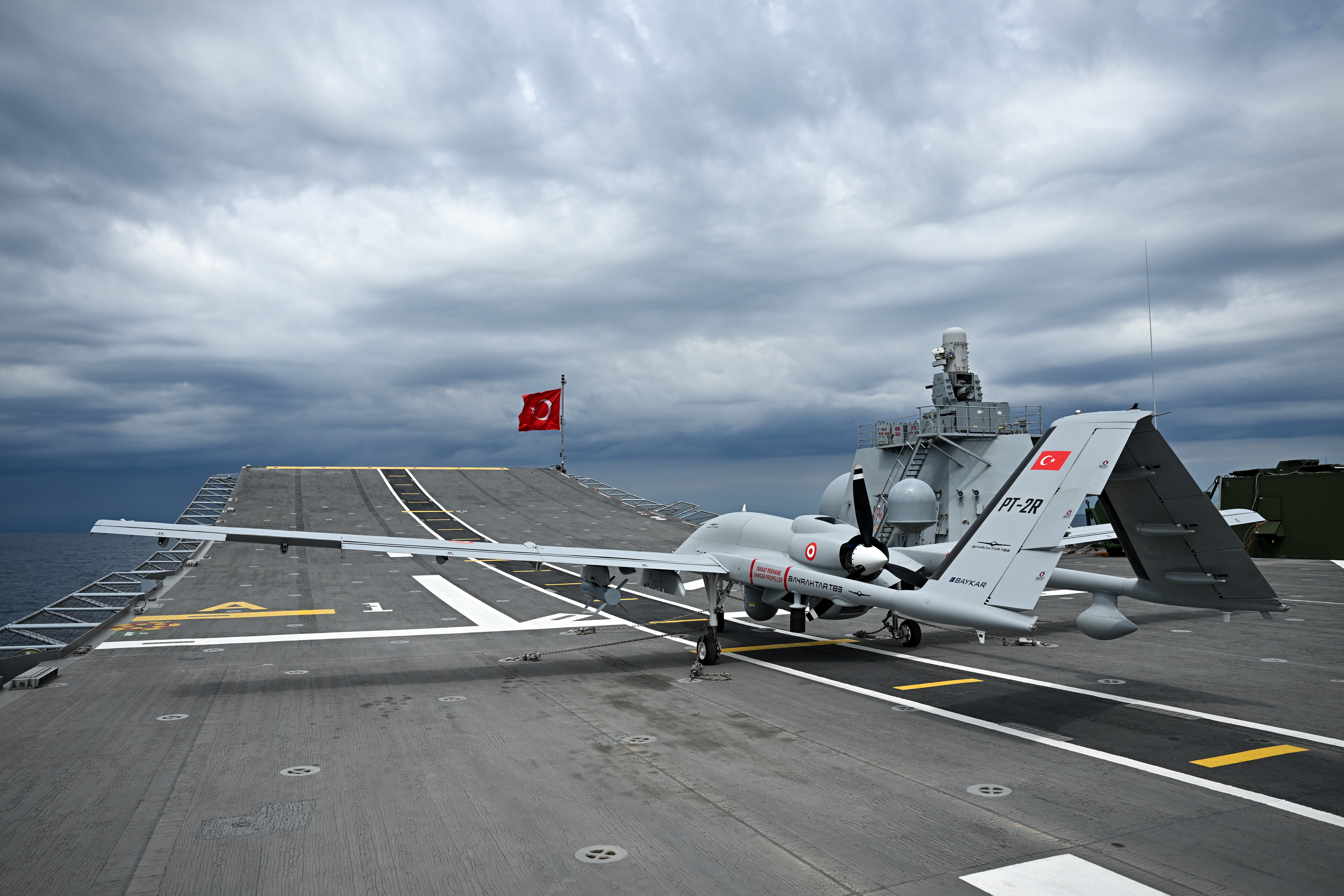 ANTALYA, TURKIYE - APRIL 09: Bayraktar TB3 unmanned aerial vehicle takes part in the live-fire phase from TCG Anadolu on the final day of the 'Blue Homeland-2026' (Mavi Vatan) tactical exercise in the Eastern Mediterranean, in Antalya, Turkiye, on April 9, 2026. The extensive drills, also conducted across the Black Sea and the Aegean Sea, involved 120 ships, 50 aircraft, and 15,000 personnel to enhance the operational readiness and coordination of the Turkish Armed Forces. (Photo by Orhan Cicek/Anadolu via Getty Images)