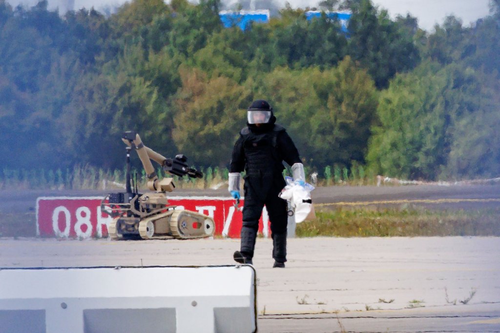 LEIPZIG, GERMANY - AUGUST 5: (EDITORS NOTE: Alternative crop of image 2288346932) A Police investigator works on the tarmac near to Ukrainian Antonov cargo plane at Leipzig/Halle Airport on August 5, 2026 near Leipzig, Germany. Airport workers reportedly discovered a drone yesterday on the tarmac near an Antonov at the airport that was equipped with an explosives detonator and an unidentified substance. Additionally, a DHL cargo plane that took off from the airport late last night collided with a small object, causing minor damage. (Photo by Jens Schlueter/Getty Images)