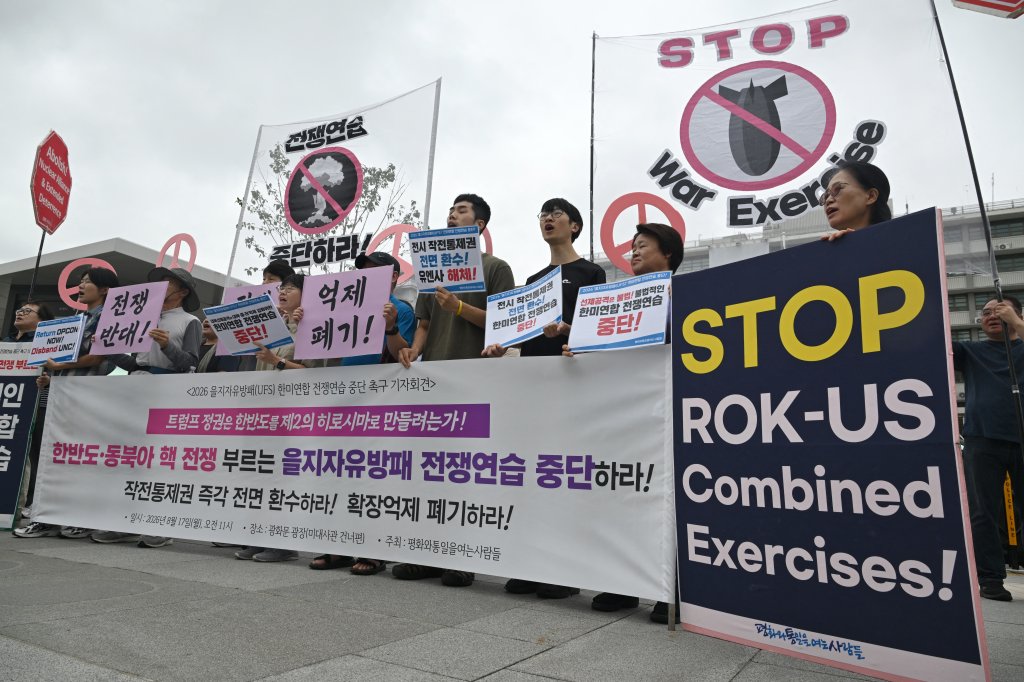 South Korean protesters hold placards as they attend a rally to oppose the joint military exercise between South Korea and the US named Ulchi Freedom Shield (UFS), in front of the US embassy in Seoul on August 17, 2026. South Korea's defence ministry said on August 17, that its joint military exercise with the United States has started after President Donald Trump's announcement it would be scaled back. (Photo by Jung Yeon-je / AFP via Getty Images)