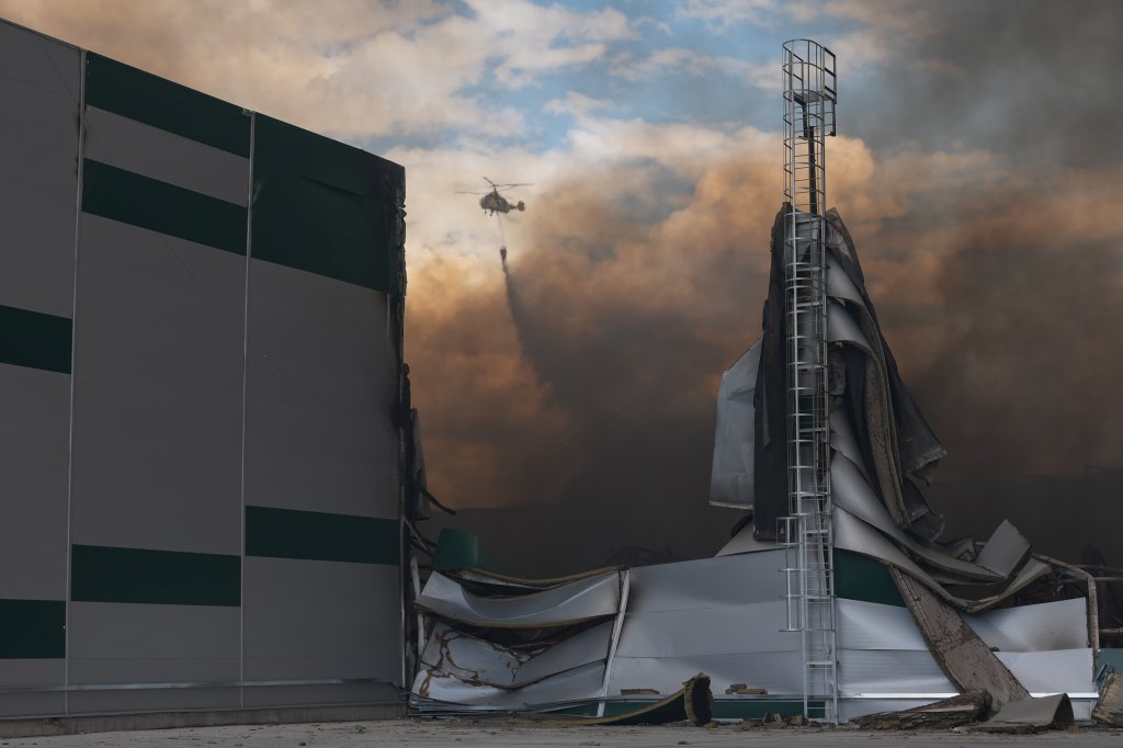 KYIV, UKRAINE - AUGUST 27: A helicopter extinguishes a fire in warehouses damaged by Russian drone strikes on August 27, 2026 in Kyiv, Ukraine. Russian forces launched a massive attack on Kyiv with drones, hitting warehouses. (Photo by Ivan Antypenko/Suspilne Ukraine/JSC "UA:PBC"/Global Images Ukraine via Getty Images)