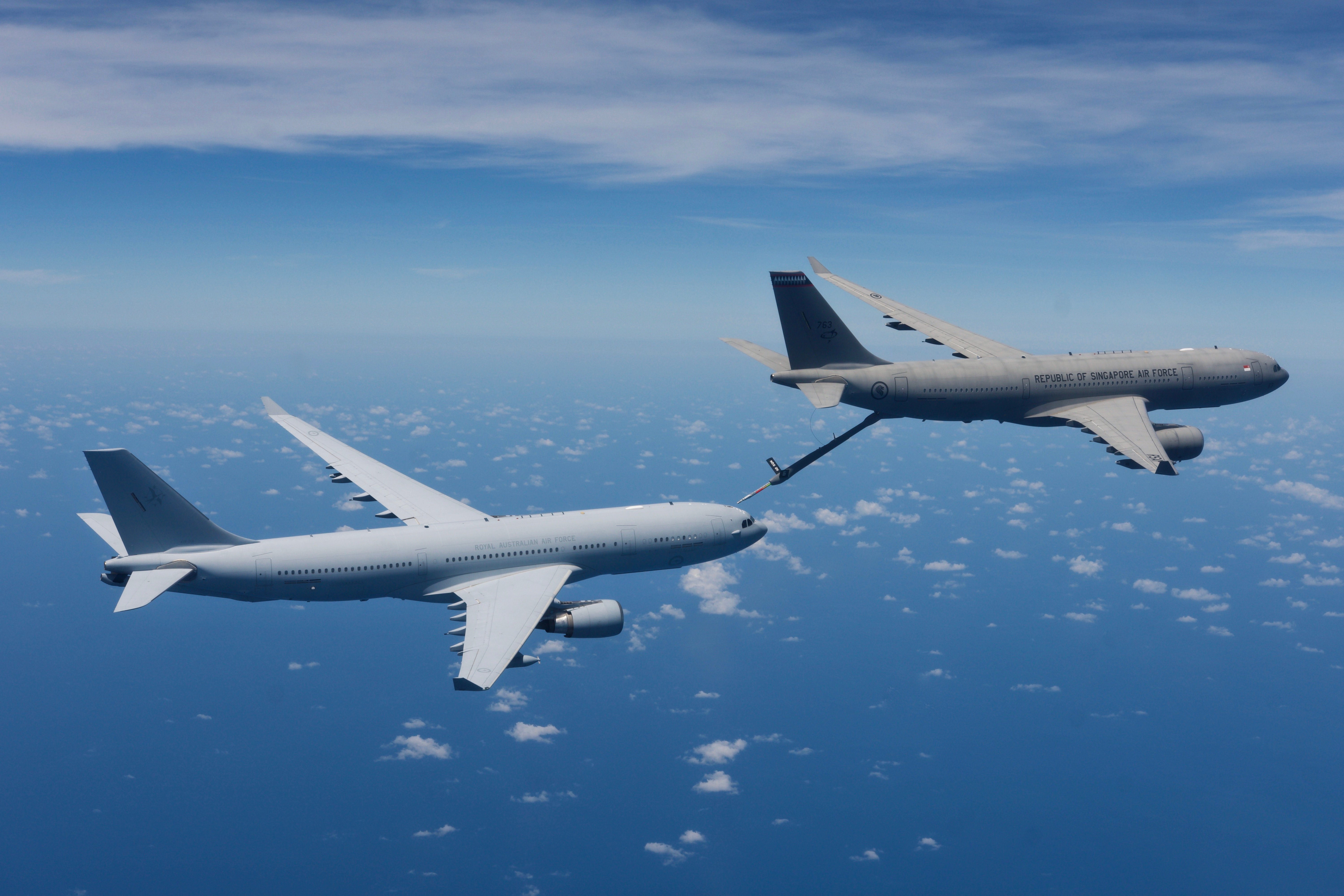 A Republic of Singapore Air Force Airbus A330 Multi-Role Tanker Transport (MRTT) refuels a Royal Australian Air Force KC-30A MRTT during a 'Boom Camp' in the Northern Territory *** Local Caption *** Combined training was conducted by air-to-air refuelling tanker crews from the Republic of Singapore Air Force (RSAF) and Royal Australian Air Force (RAAF) at RAAF Base Darwin over 25 to 30 October 2020. Both nations operate variants of the Airbus A330 Multi-Role Tanker Transport (MRTT), which in RAAF service is called the KC-30A, and can carry a fuel load in excess of 100 tonnes that can be transferred in-flight to compatible receiver aircraft. The combined training at RAAF Base Darwin was an opportunity to compare experiences operating the MRTT and build working-level relationships, forging closer ties between RSAF’s No. 112 Squadron and the RAAF’s No. 33 Squadron. The RAAF was the world’s first MRTT operator, introducing the aircraft to service in 2011. The RSAF received its first MRTT in 2018 but has extensive experience with conducting air-to-air refuelling with the previous KC-135 Stratotanker, which had previously been used in support of RAAF exercises and training activity. read less