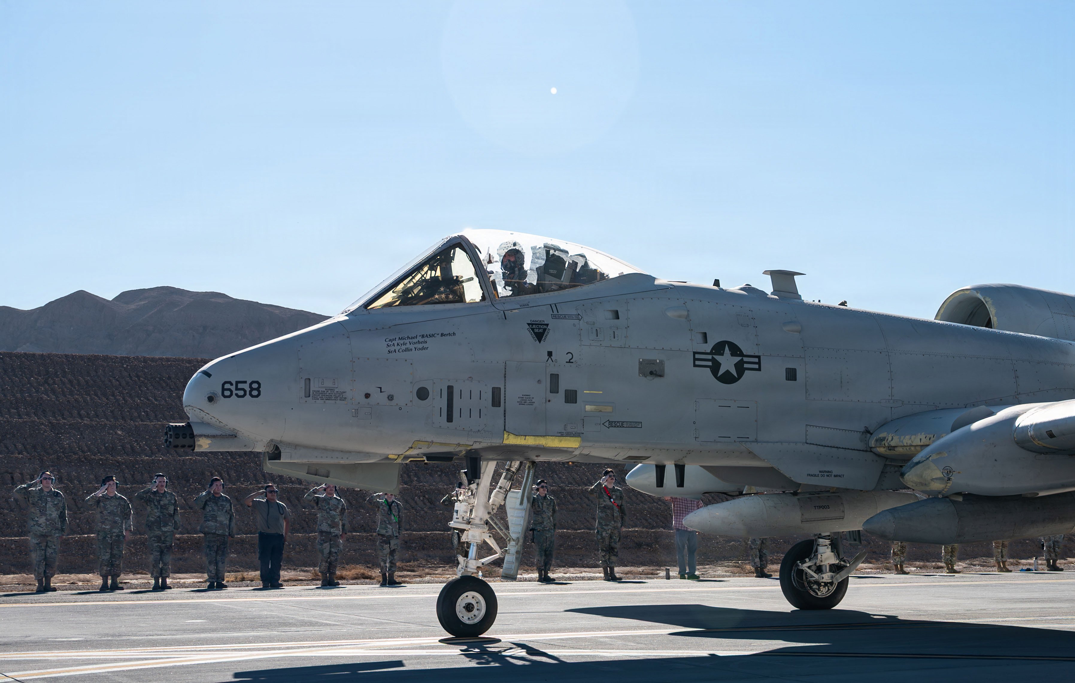 U.S. Airmen assigned to Nellis Air Force Base salute an A-10 Thunderbolt II aircraft at Nellis AFB, Nevada, Sept. 22, 2026. The flight marked the final departure of Nellis’ last A-10 and honored nearly half a century of close air support service and the maintainers, pilots, and support personnel who kept the fleet mission-ready. (U.S. Air Force photo by Airman Isabella Borrillo)