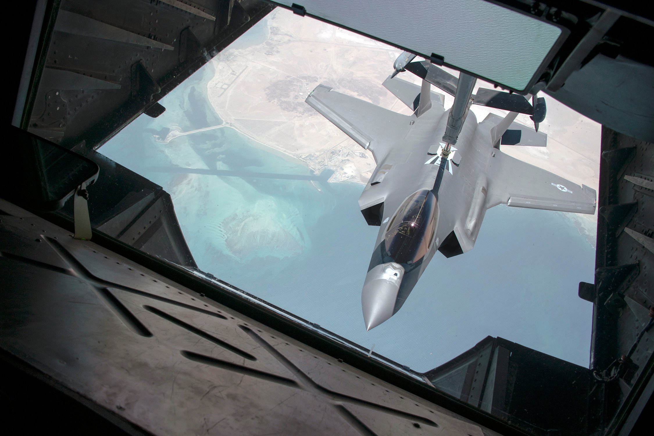 A 34th Expeditionary Fighter Squadron F-35 Lighting II conducts an inflight refueling with a 908th Expeditionary Air Refueling Squadron KC-10 Extender in the skies above the United Arab Emirates, May 8, 2020. The F-35A is the U.S. Air Force’s latest fifth-generation fighter. It has an enhanced capability to survive in the advanced threat environment in which it was designed to operate. With its aerodynamic performance and advanced integrated avionics, the F-35A provides next-generation stealth, enhanced situational awareness, and reduced vulnerability for the United States and allied nations. (U.S. Air Force photo by Tech. Sgt. Kat Justen)