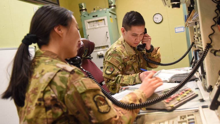 2nd Lt. Michelle Lee and Capt. William Yau conduct pre-operational checks inside of a Launch Control Center used for training purposes at Minot Air Force base, North Dakota, Mar. 7, 2022. The 91st Missile Wing contributes to the nation's strategic defense by sustaining and operating various Minuteman III intercontinental ballistic missiles and the associated launch facilities.