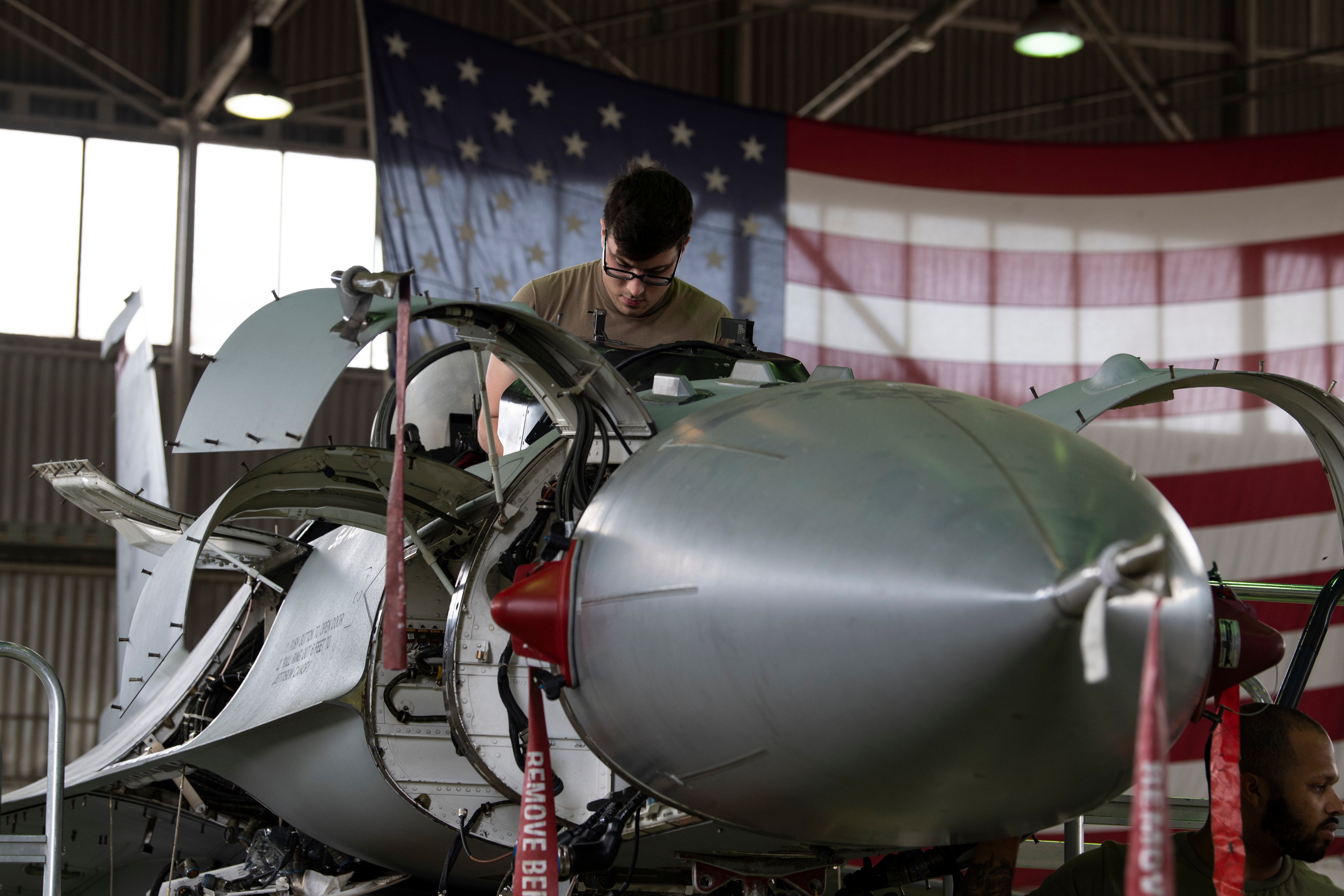 U.S. Air Force Senior Airman David Dussault, 52nd Aircraft Maintenance Squadron F-16 avionics journeyman, works to install a new active electronically scanned array (AESA) radar system onto a 480th Fighter Squadron F-16C Fighting Falcon at Spangdahlem Air Base, Germany, May 23, 2022. The AESA upgrade provides F-16s a massive leap in combat capabilities, making pilots even more effective than ever before while improving air defenses and overall aircraft survivability when faced with enemy forces. (U.S. Air Force photo by Tech. Sgt. Maeson L. Elleman)