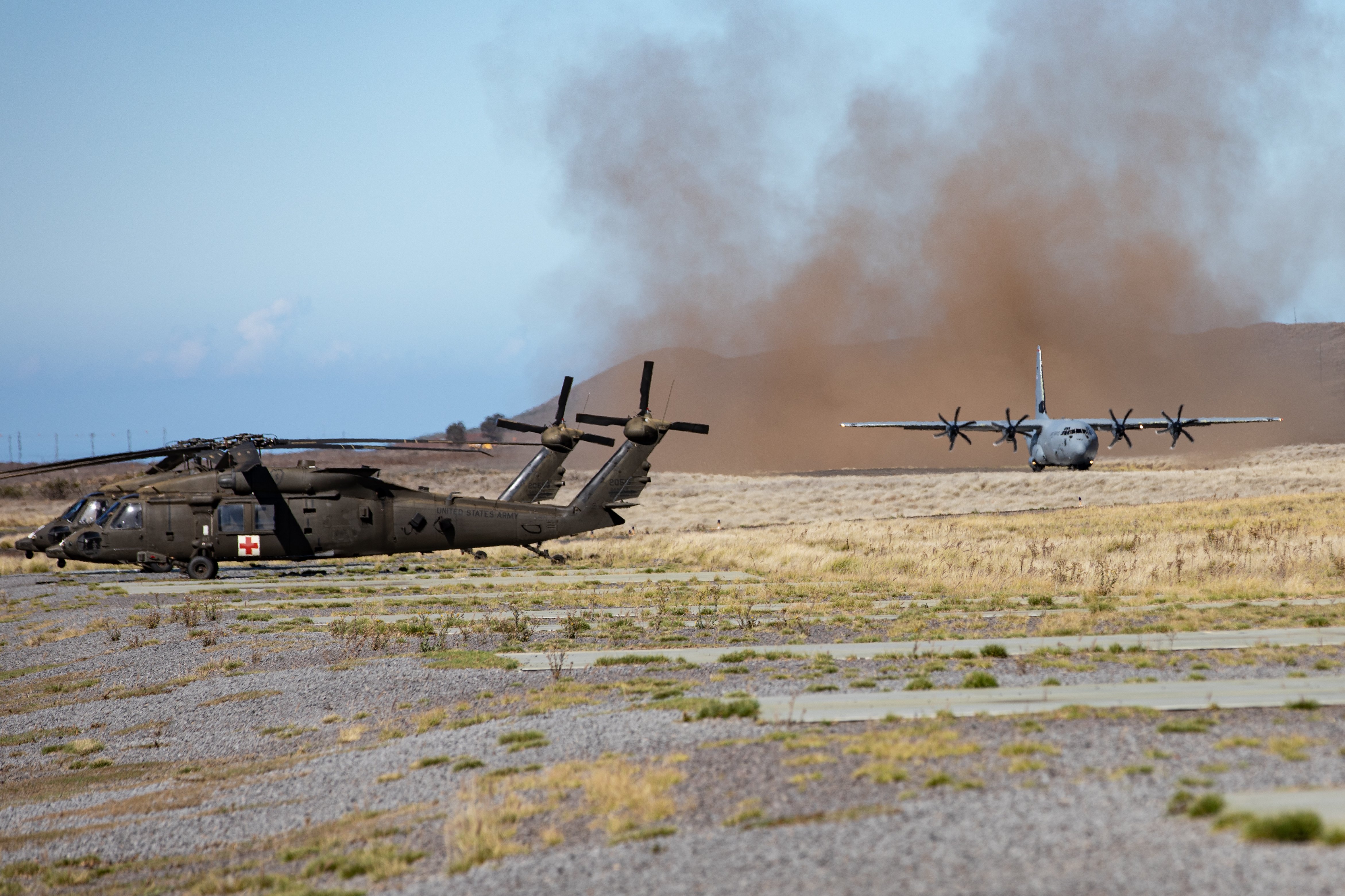 A U.S. Military C-130 prepares for takeoff at Pohakuloa Training Grounds, Hawaii, Oct 28, 2022. JPMRC 23-1 is a regional combat training center (CTC) rotation that builds combat readiness in Americas Pacific Division and is a key way the Army forces engage in a joint environment with our regional allies and partners. (U.S. Army photo by Pfc. Wyatt Moore / 28th Public Affairs Detachment)