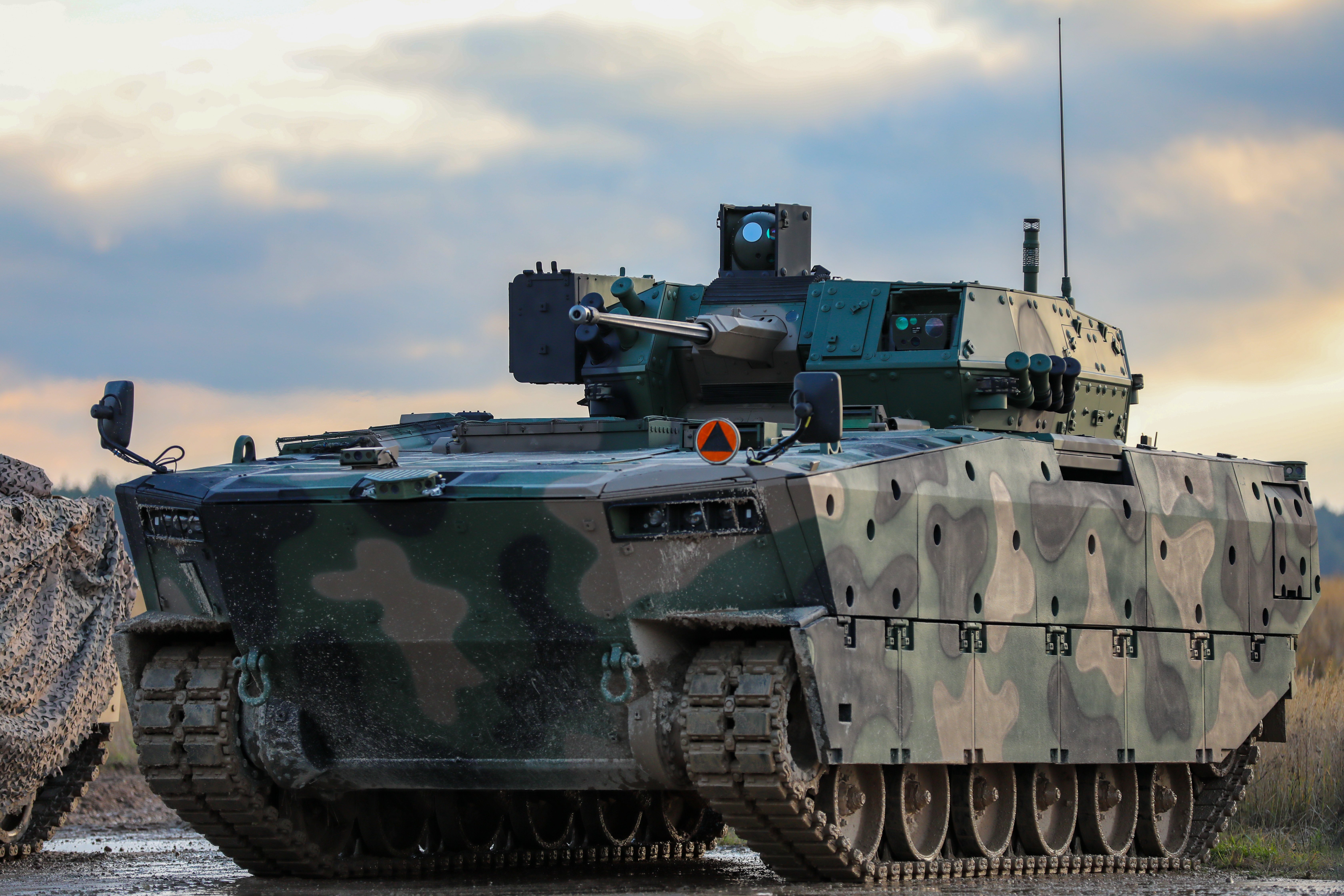 NATO enhanced Forward Presence Battle Group Poland adds the Polish Infantry Fighting Vehicle, the Borsuk (Badger) to its arsenal for the Polish armed forces 15th Mechanized Infantry Brigade, stages for display during the unveiling ceremony in front of the Poland Deputy Prime Minister, Mariusz Błaszczak, Minister of National Defense joined by U.S. Soldiers assigned to 3rd Battalion, 8th Cavalry Regiment, 3rd Armored Brigade Combat Team, 1st Cavalry Division (3-1 ABCT) operationally controlled by the 1st Infantry Division (1 ID), Polish armed forces 15th Mechanized Infantry Brigade, The Royal Lancers, Prince of Wales Troop, Romanian Sky Guardians, Croatian army Archer Battery, and the media in Bemowo Piskie, Poland, Nov. 14, 2022. The 3-1 ABCT is among other units assigned to the 1 ID, proudly working alongside NATO allies and regional security partners to provide combat-credible forces to V Corps, America's forward deployed corps in Europe. (U.S. Army National Guard photo by Staff Sgt. Matthew A. Foster)