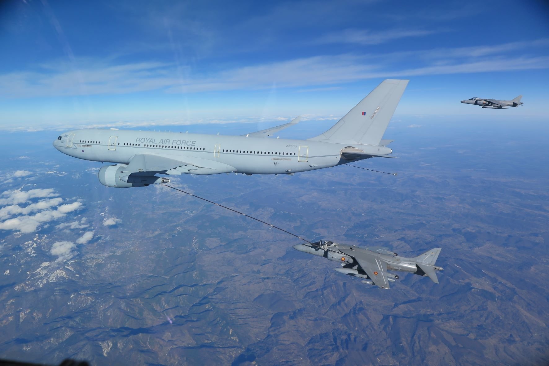 230220-N-NO777-1002 ROMANIA (Feb. 20, 2023) A Royal Air Force A330 tanker performs aerial refueling of a Spanish Navy AV-8B Harrier during combined long range strike training, Feb. 20, 2023. The George H.W. Bush Carrier Strike Group is on a scheduled deployment in the U.S. Naval Forces Europe area of operations, employed by U.S. Sixth Fleet to defend U.S., allied, and partner interests. (U.S. Navy courtesy photo)