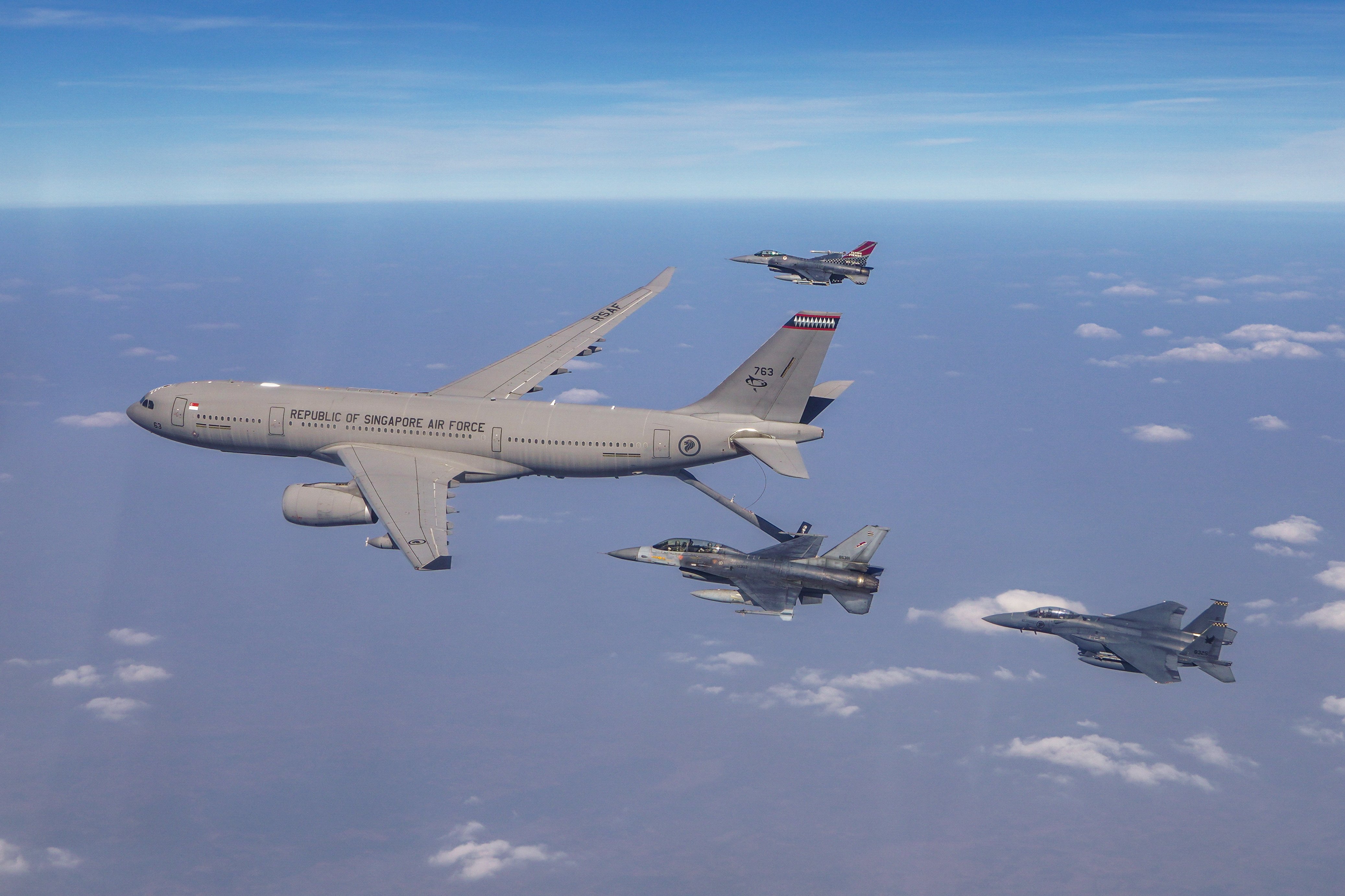 A Republic of Singapore Air Force A330 Multi Role Tanker Transport leads a formation flight during a training scenario alongside a U.S. Air Force F-16C assigned to the 36th Fighter Squadron, Osan Air Base, Republic of Korea, two RSAF F-15SGs, and a Royal Thai Air Force F-16ADF during Exercise Cope Tiger 23, Korat Royal Thai Air Base, Kingdom of Thailand, March 22, 2023. CT 23 is an annual exercise meant to improve readiness and the ability of participating forces to operate together while enhancing military relations and combined capabilities. (Courtesy Photo)