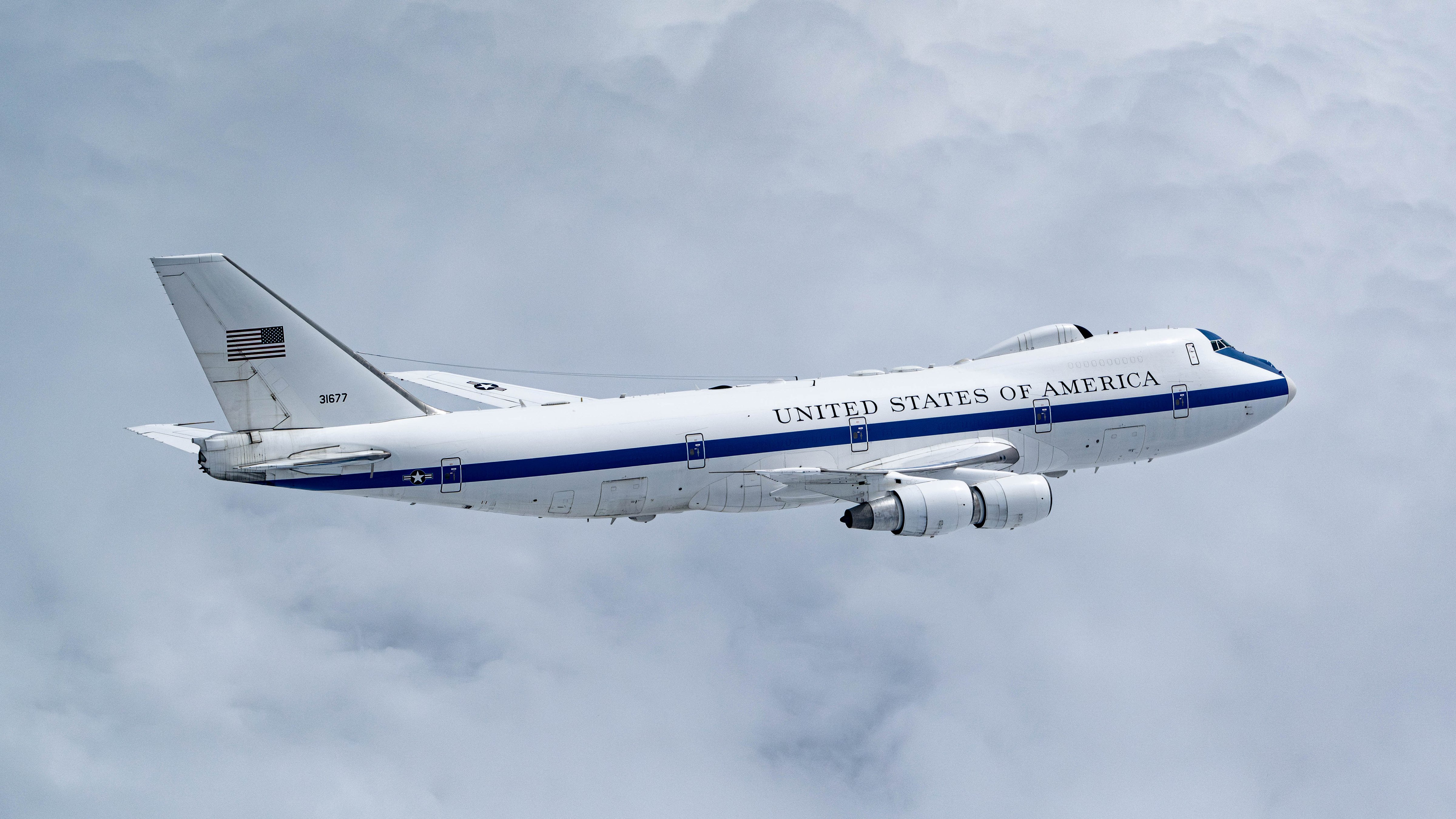 A U.S. Air Force E-4B assigned to the 595th Command & Control Group, Offutt Air Force Base, Neb., flies on a training sortie over the Midwest, May, 15, 2024. The E-4B "Nightwatch" serves as the National Airborne Operations Center and is a key component of the National Military Command System for the President, the Secretary of Defense and the Joint Chiefs of Staff. In case of national emergency or destruction of ground command and control centers, the aircraft provides a highly survivable command, control and communications center to direct U.S. forces, execute emergency war orders, and coordinate actions by civil authorities. (U.S. Air Force photo by Tech. Sgt. Codie Trimble)