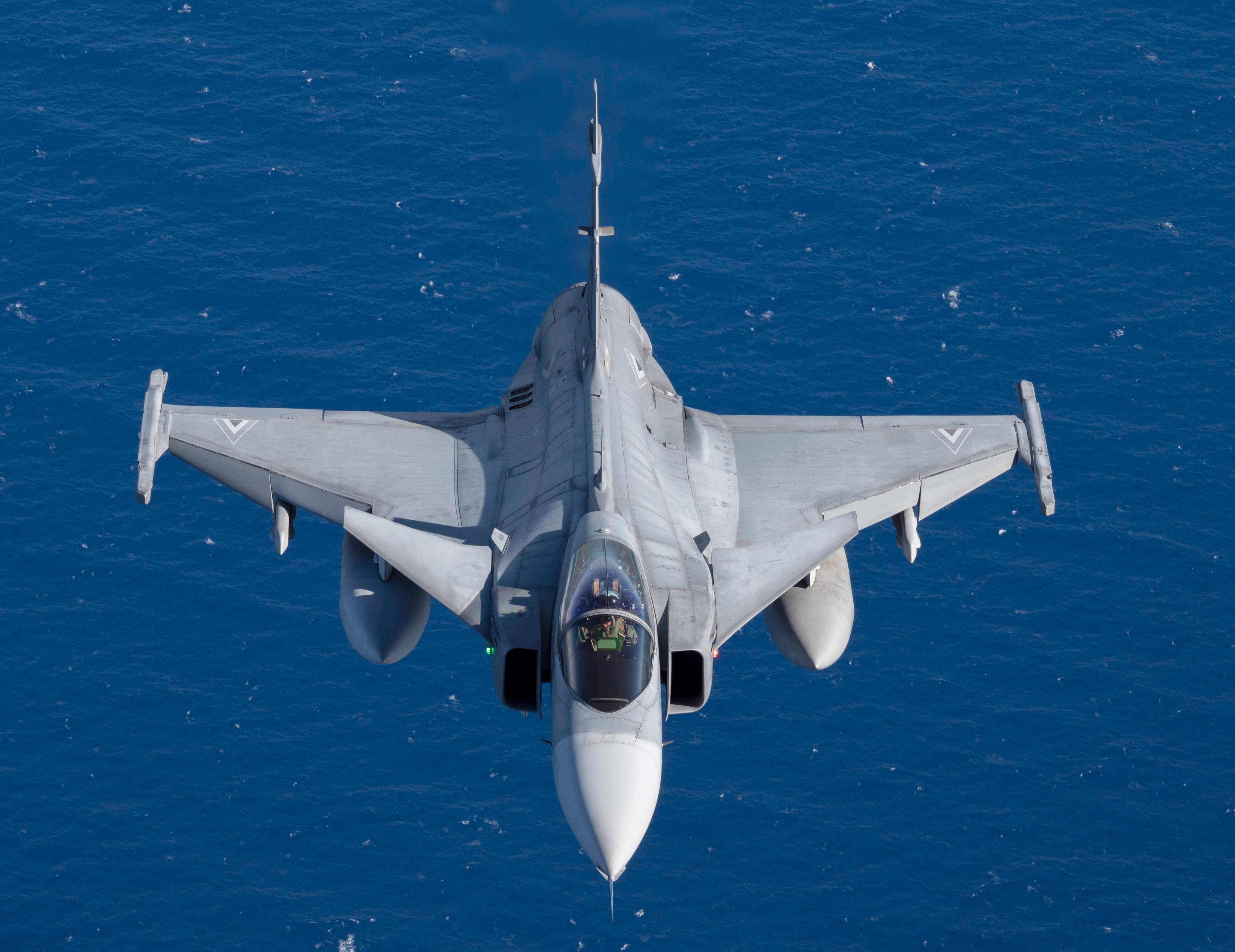 A Hungarian Air Force JAS 39 Gripen participating in NATO exercise Ramstein Flag 24 flies over the west coast of Greece, Oct. 4, 2024. Over 130 fighter and enabler aircraft from Greece, Canada, France, Hungary, Italy, Poland, Portugal, Romania, Spain, Sweden, United Kingdom and United States are training side by side to improve tactics and foster more robust integration, demonstrating NATO’s resolve, commitment and ability to deter potential adversaries and defend the Alliance. (U.S. Air Force photo by Tech. Sgt. Emili Koonce)