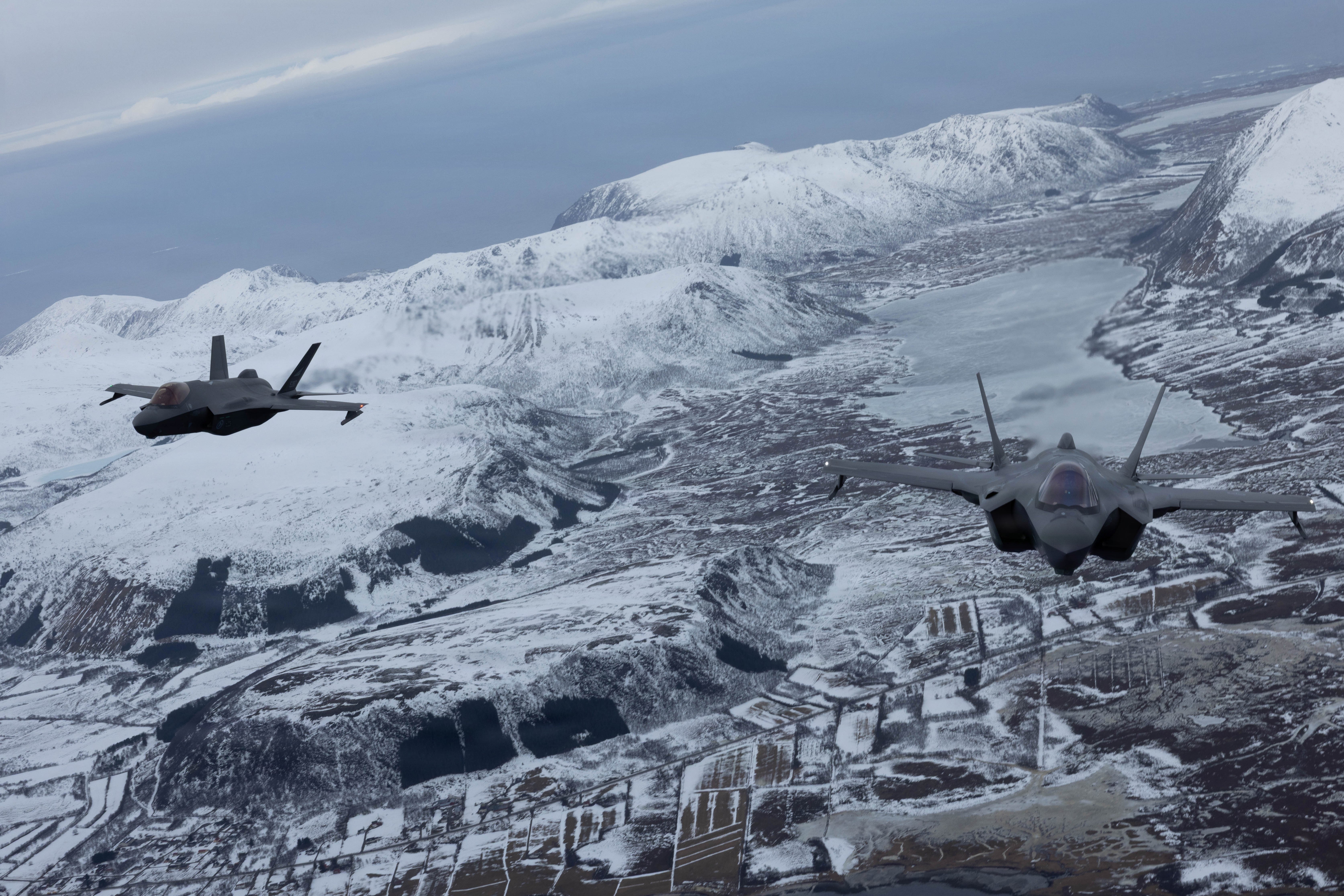 F-35A Lightning II aircraft from the U.S. Air Force’s 48th Fighter Wing and the Royal Norwegian Air Force fly tandem after a formation flight near Lofoten, Norway, March 10, 2026. The formation flight symbolized the partnership and degree of interoperability displayed between participating NATO militaries during exercise Cold Response 26. A key component of NATO's enhanced vigilance activity Arctic Sentry, exercise Cold Response 26 is a Norwegian-led winter military exercise designed to enhance collective defense capabilities and ensure U.S. readiness to rapidly deploy and seamlessly operate alongside NATO Allies in challenging arctic conditions. (U.S. Marine Corps photo by Cpl. Mya Seymour)